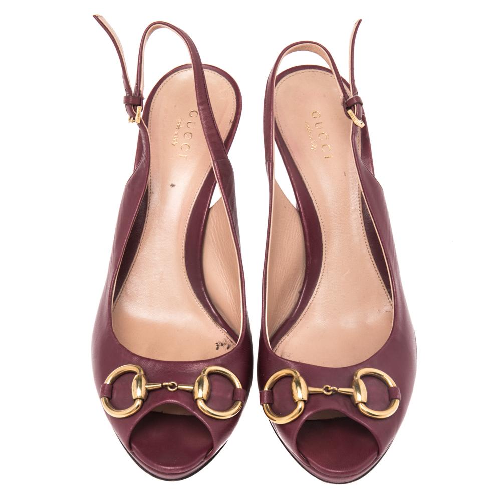 The Horsebit is a highly popularized signature accent from the House of Gucci. These sandals incorporate a gold-toned Horsebit accent into their shape to grant symbolic beauty and appeal. Additionally, they feature a burgundy leather exterior,