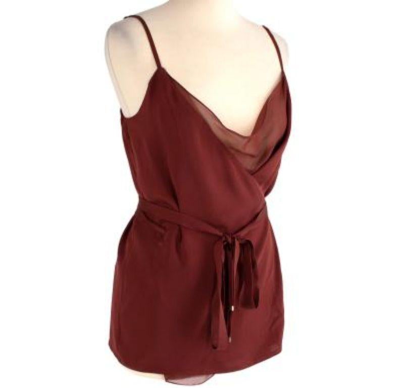 Gucci Burgundy Silk Crepe & Chiffon Wrap Camisole

- Thin shoulder straps
- Waist belt fasteining
- Fully lined
- Gold-toned hardware
- Branded hardware
- Light construction

Material
100% Silk

Made in Italy

9.5/10 Excellent condition

PLEASE