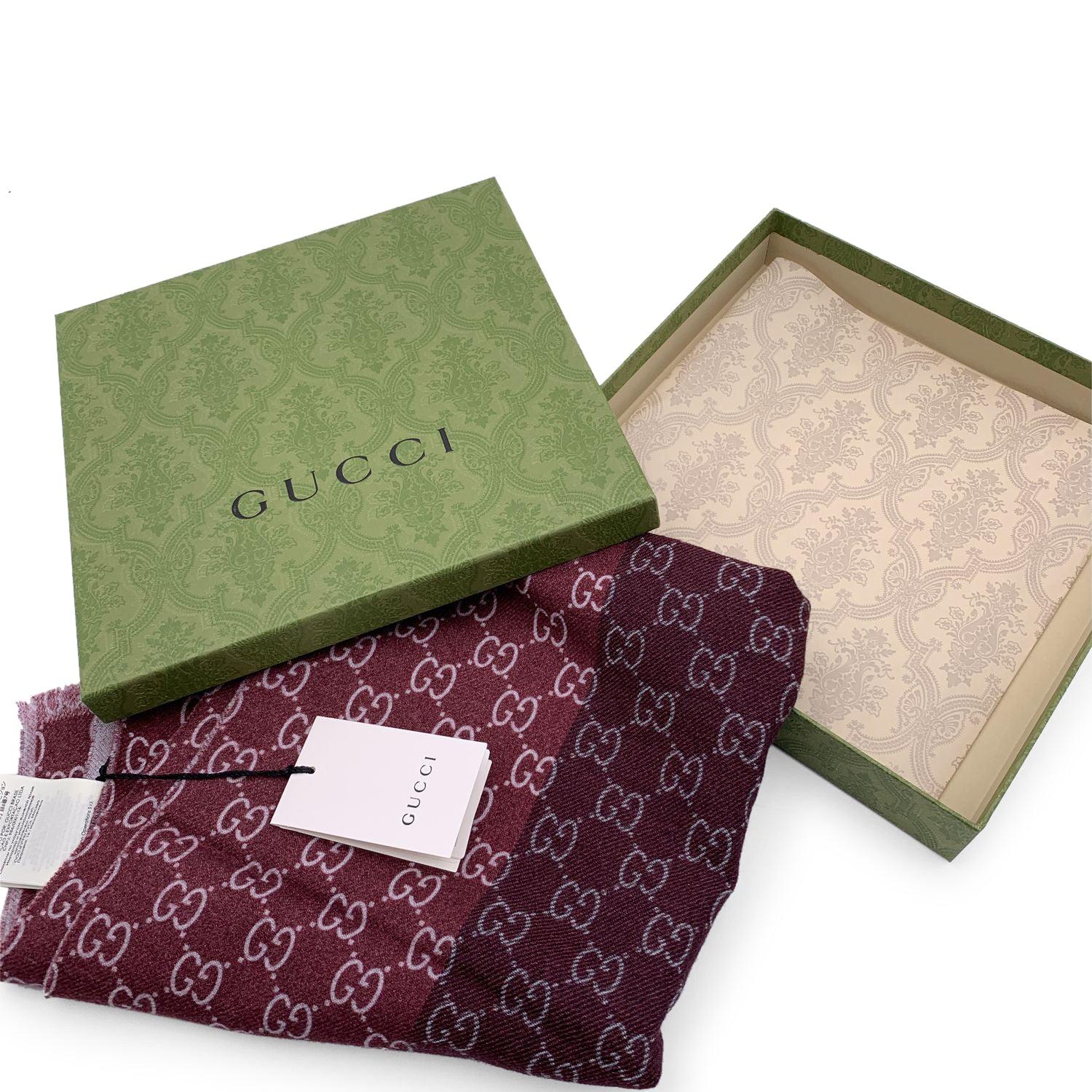 Burgundy and grey GG Guccissima wool scarf by Gucci. Composition: 100% wool. Width: 45 cm. Lenght: 180 cm. Frayed edges. Made in Italy. Details MATERIAL: Wool COLOR: Burgundy MODEL: n.a. GENDER: Unisex Adults COUNTRY OF MANUFACTURE: Italy FEATURES: