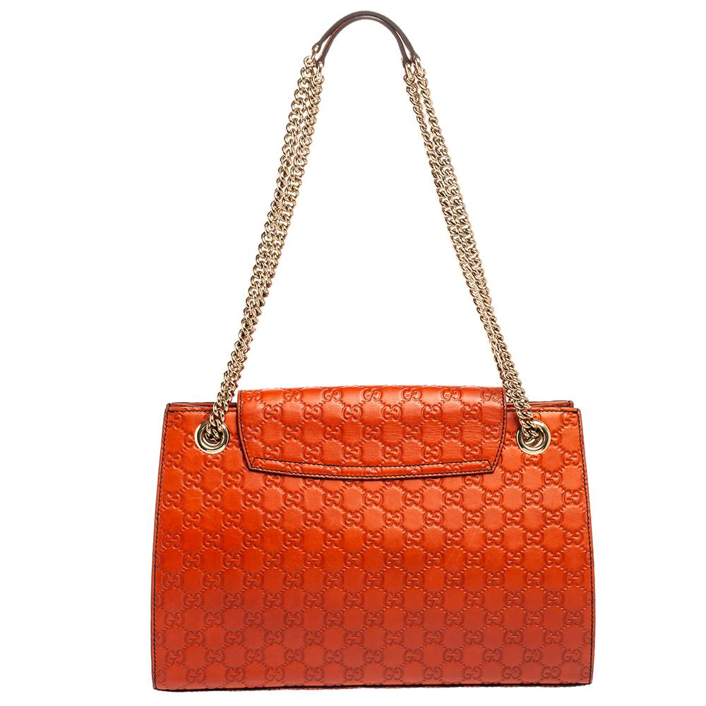 The House of Gucci, with its nonpareil skill and métier, amazes us all once again. This Emily shoulder bag from Gucci brings a different level of luxury and poise to your collection. Designed using burnt-orange Guccissima leather, the front of this
