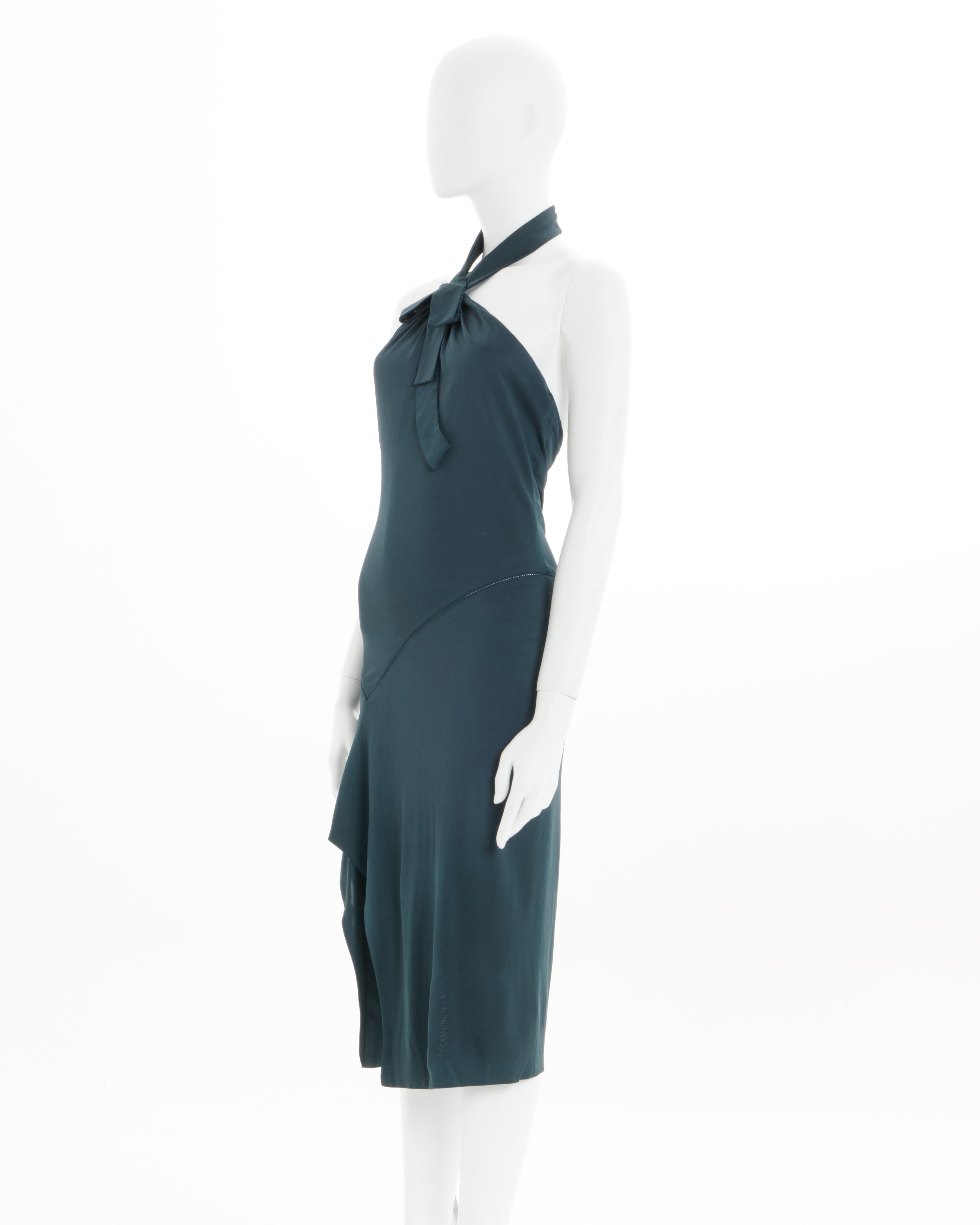 Gucci by Alessandra Facchinetti 
Fall - Winter 2005 
Green lycra halter cocktail dress
Open back sleeveless dress
Above knee length 
Hidden zipper closure 
Right side slit 
American neckline 
Neckline bow detail 
Size: FR 36 - IT 40 - UK 8 - US 4