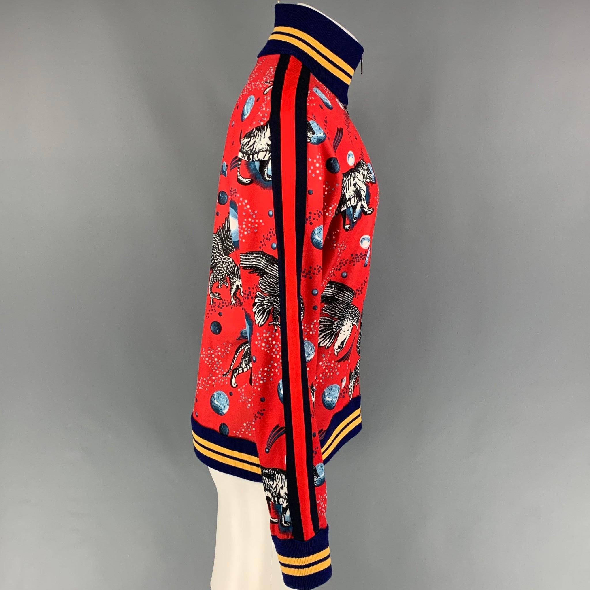 GUCCI by Alessandro Michele FW 17 jacket comes in a red 'space animal' graphic print featuring a high collar, striped ribbed hem, slit pockets, and a full zip up closure. Made in Italy.
Excellent
Pre-Owned Condition. 

Marked:   M  

Measurements: 
