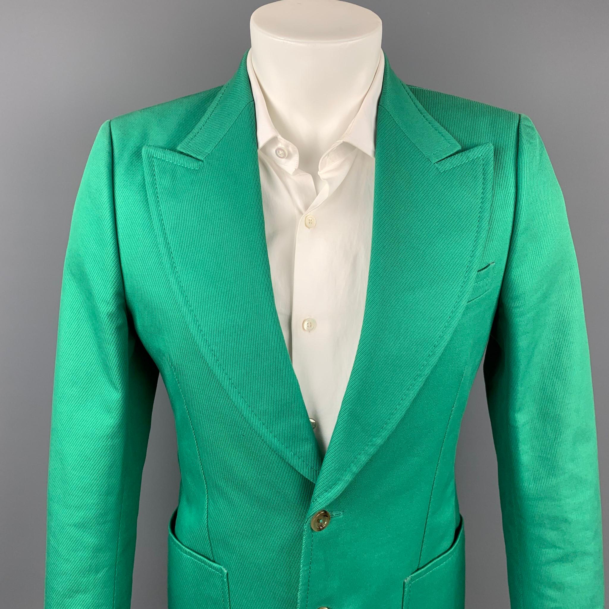 GUCCI by Alessandro Michele sport coat comes in a green cotton with a full liner featuring a peak lapel, patch pockets, and a two button closure. Made in Italy.

Very Good Pre-Owned Condition.
Marked: 7/46 R

Measurements:

Shoulder: 16.5 in.
Chest: