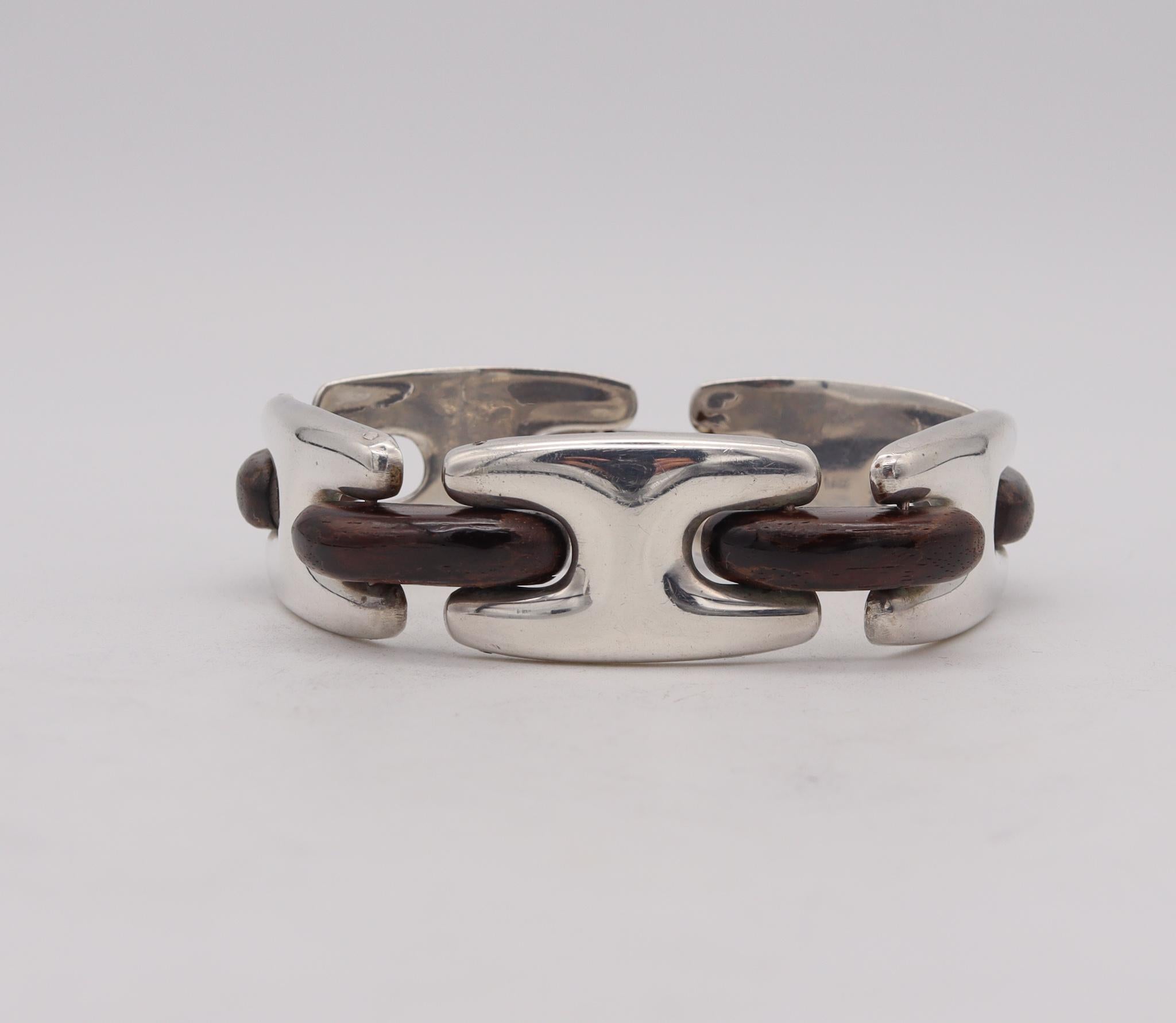 A wood bracelet designed by Missiaglia.

Gorgeous modernist bracelet, created in Venice Italy by the exclusive jewelry house of Missiaglia during the late mid-century period, back in the 1960's. This rare and outstanding bracelet has been carefully