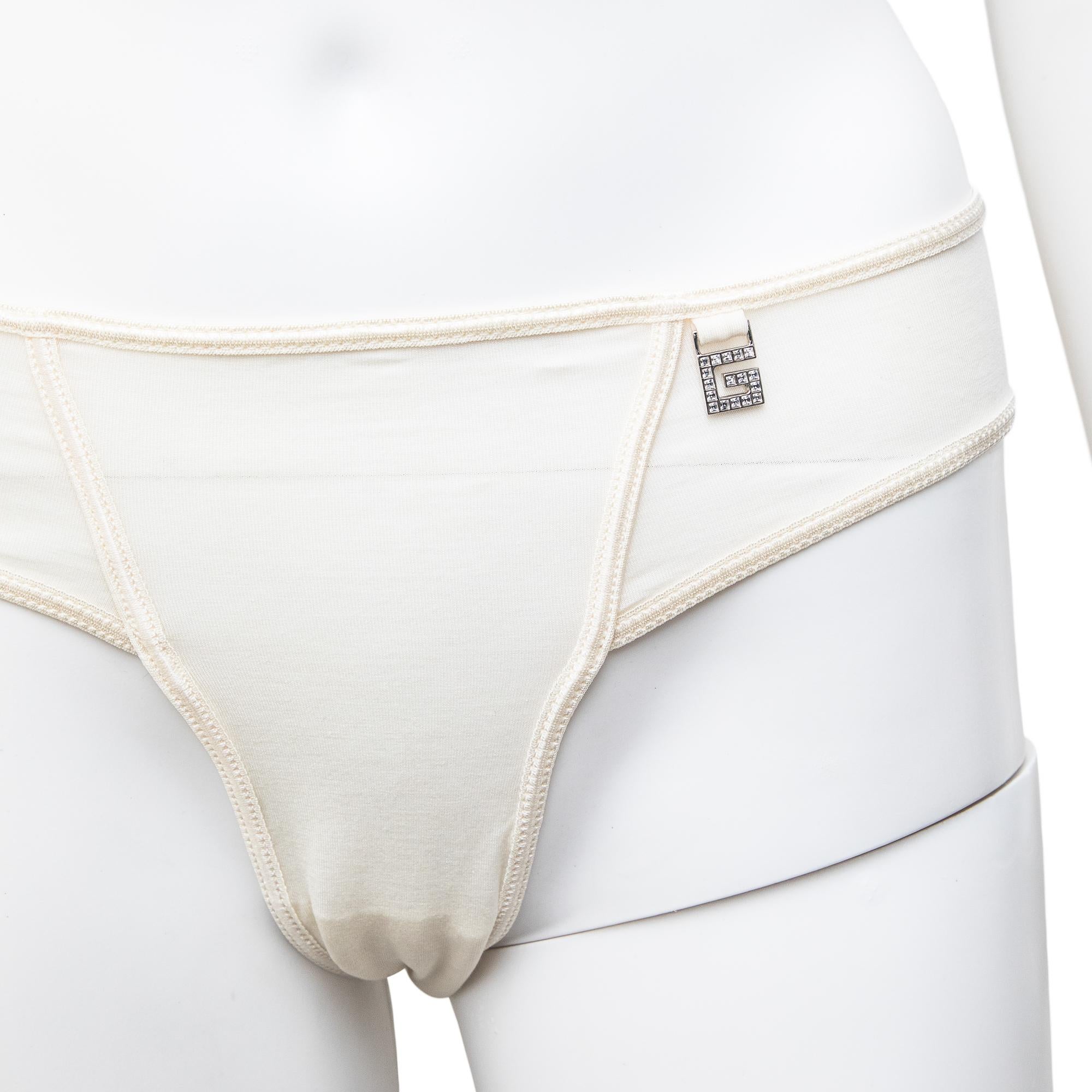 Ruder Than The Rest presents a spring-summer 1998 Gucci briefs with Swarovski crystal G logo detail.

Designed by Tom Ford.

This brief design was used for the runway but in the monogram fabric iteration. 

Off-white jersey fabric.

Silver G logo