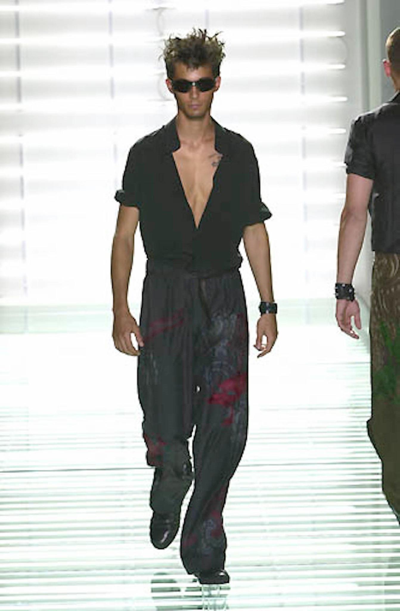 GUCCI by TOM FORD Spring Summer 2001 Collection karate style pants come in black silk with dragon embroidery throughout, button fly, tied drawstring waistband, and a quilted hem. Made in Italy. 

Excellent Pre-Owned Condition. 
Marked: