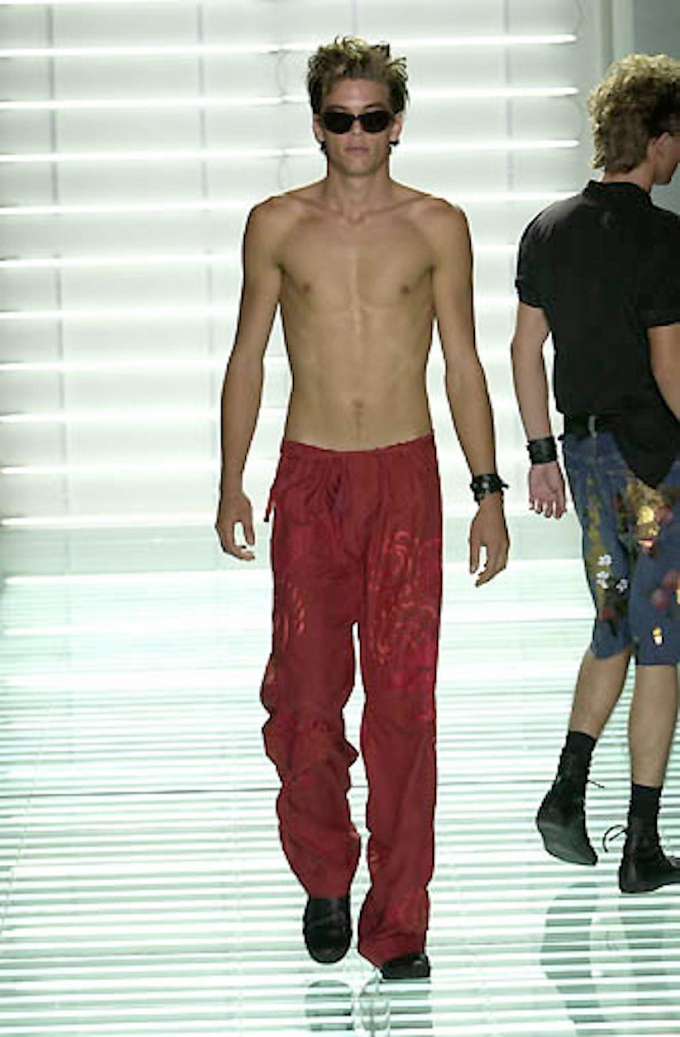 GUCCI by TOM FORD Spring Summer 2001 Collection karate style pants come in red silk with dragon embroidery throughout, button fly, tied drawstring waistband, and a quilted hem. Made in Italy. 

Good Pre-Owned Condition. Marks at back.
Marked: