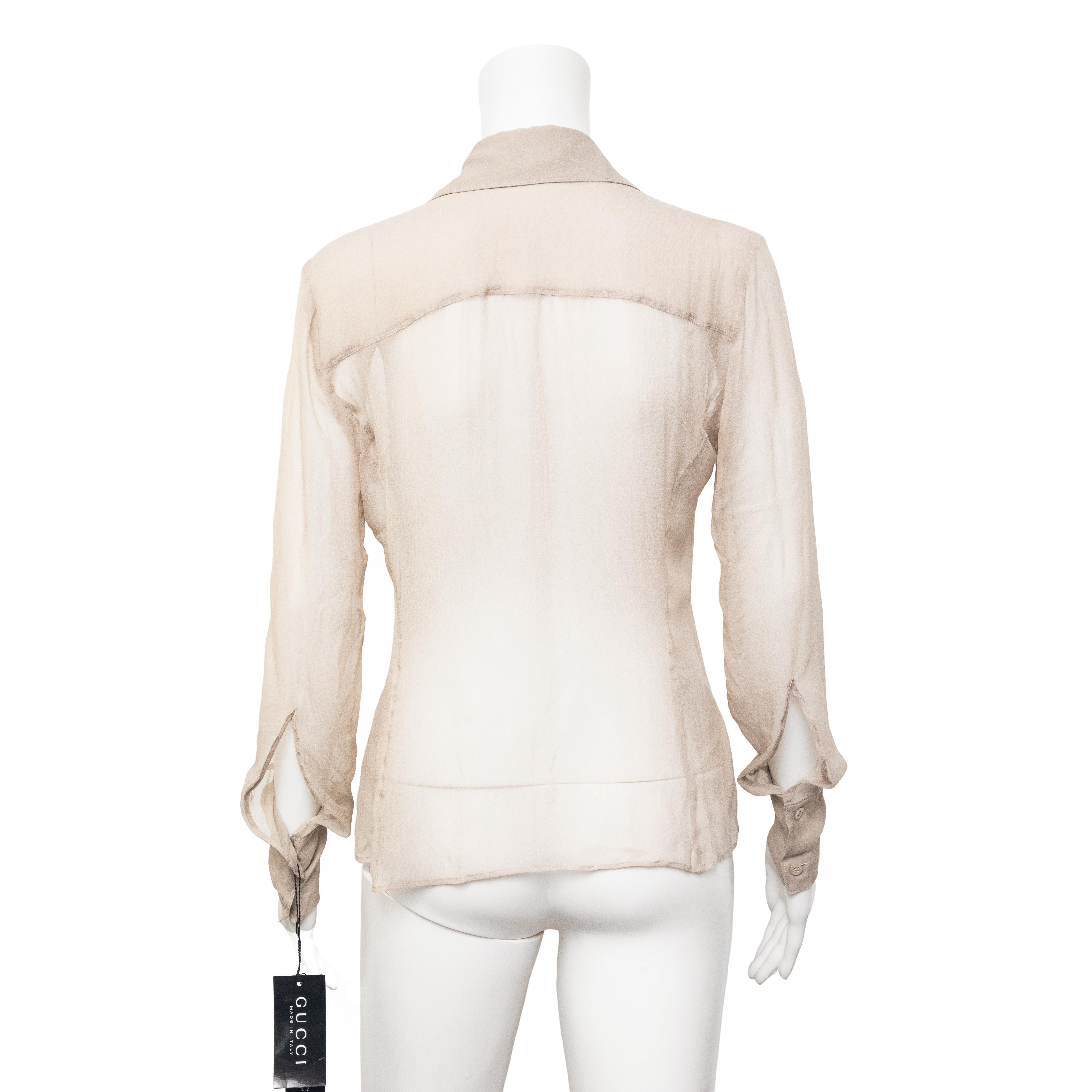 Ruder Than The Rest presents a spring-summer 2002 Gucci sheer silk shirt.

Boho style lace up frontal design.

Sheer silk chiffon fabric.

Double buttoned cuffs.

Composition: 100% silk.

Made in Italy.

Vintage, 2002.

Authenticity