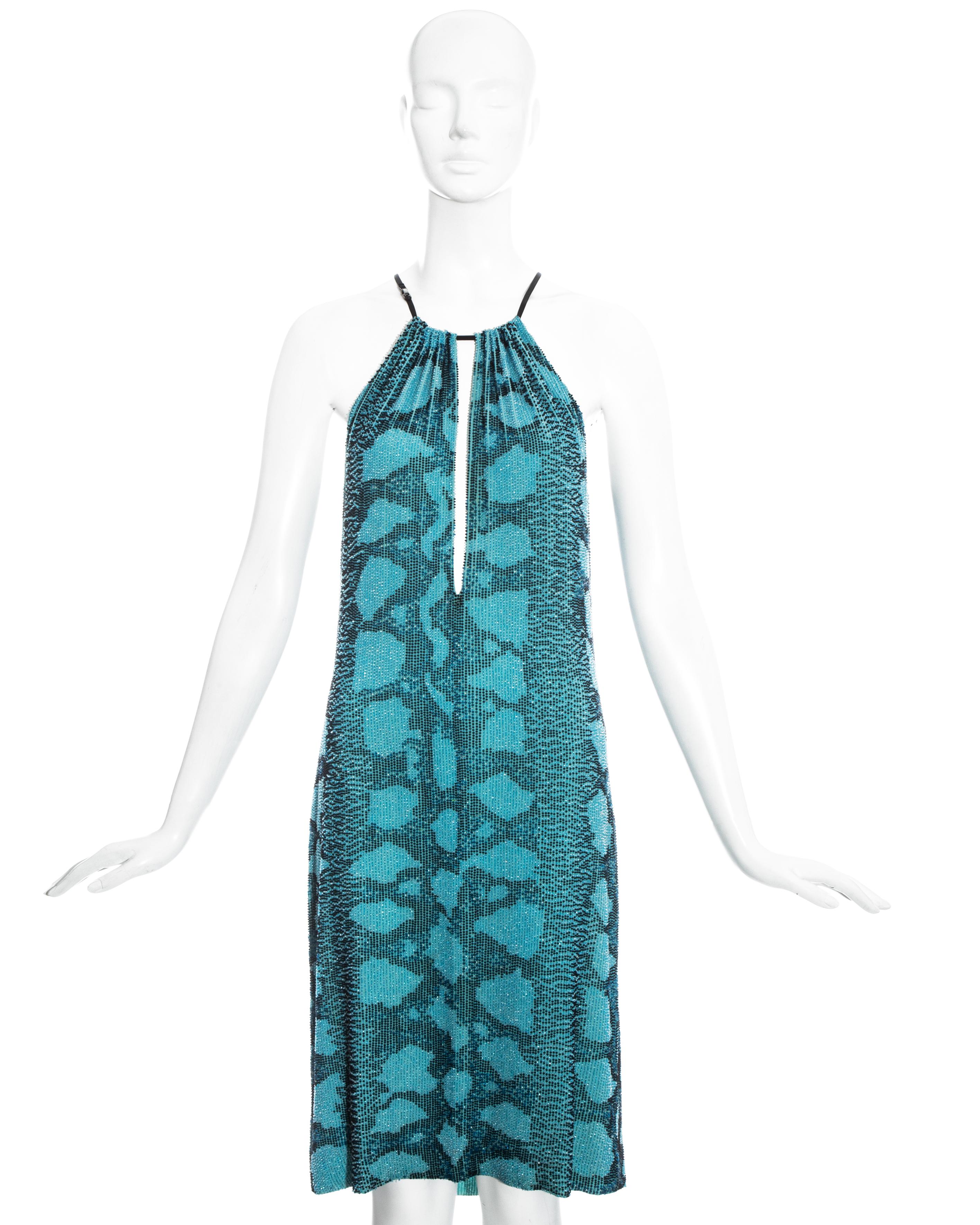 Gucci by Tom Ford aqua blue beaded evening dress with plunging neckline, silk lining and black leather shoulder strap with Gucci stamped metal clasp.

Spring-Summer 2000