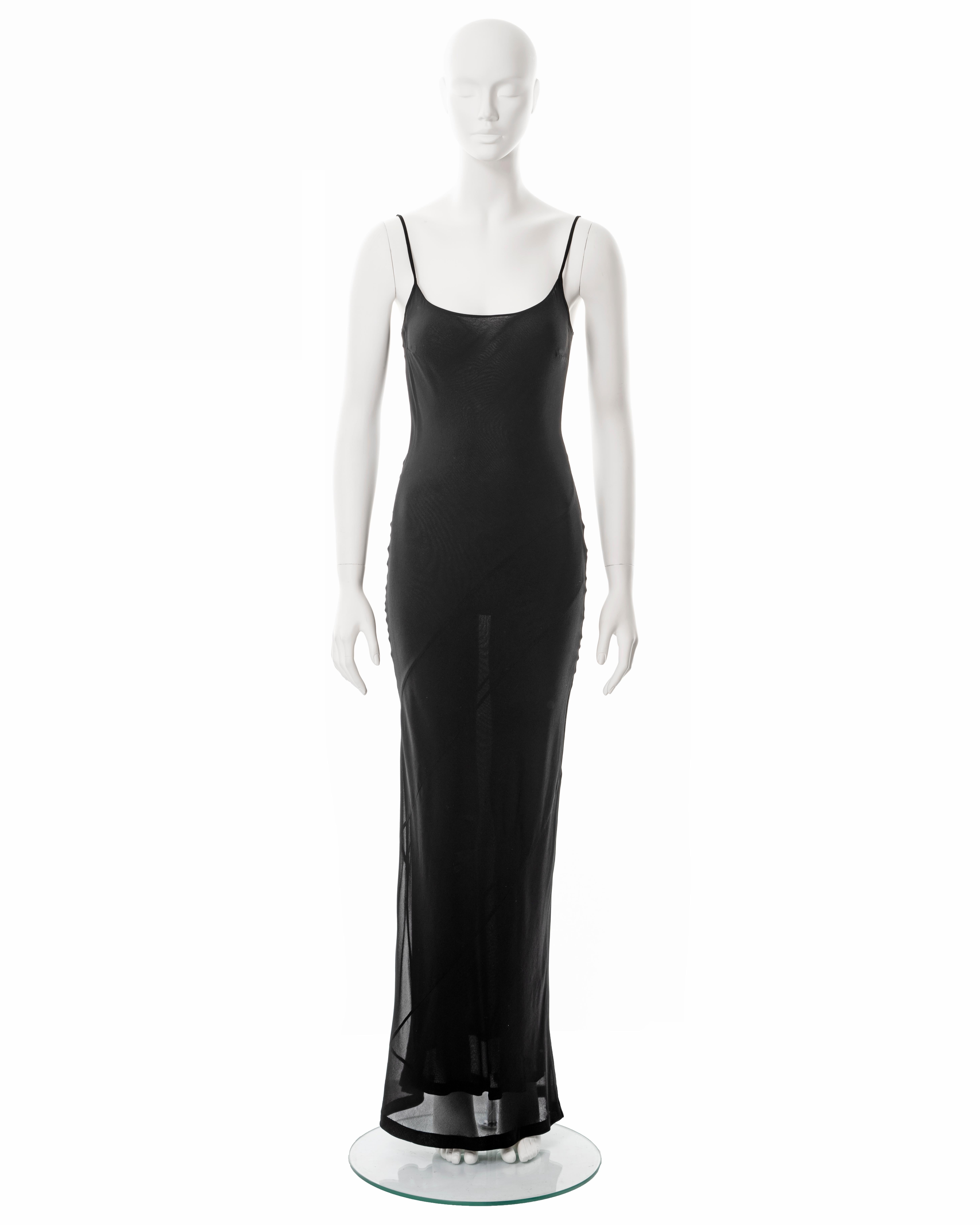 ▪ Gucci black evening slip dress
▪ Designed by Tom Ford
▪ Sold by One of a Kind Archive
▪ Spring-Summer 1997
▪ Constructed from black bias-cut silk-rayon blend crepe chiffon
▪ Double-layered
▪ Scoop neck
▪ Spaghetti straps 
▪ Floor length skirt 
▪
