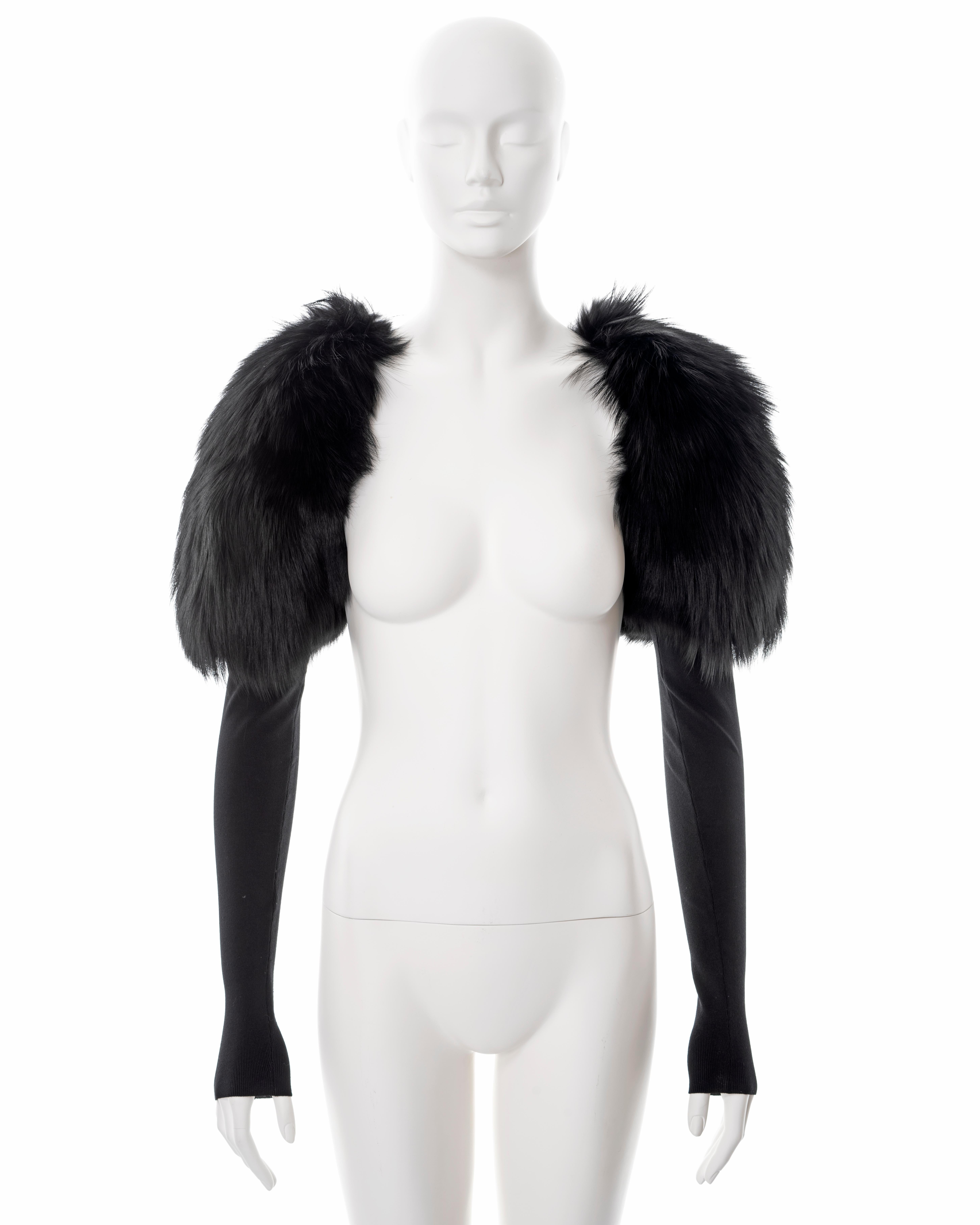 ▪ Gucci shrug 
▪ Designed by Tom Ford
▪ Sold by One of a Kind Archive
▪ Black fox fur shoulders 
▪ Long fitted silk-nylon jersey sleeves 
▪ Size Small
▪ Made in Italy

All photographs in this listing EXCLUDING any reference or runway imagery needs