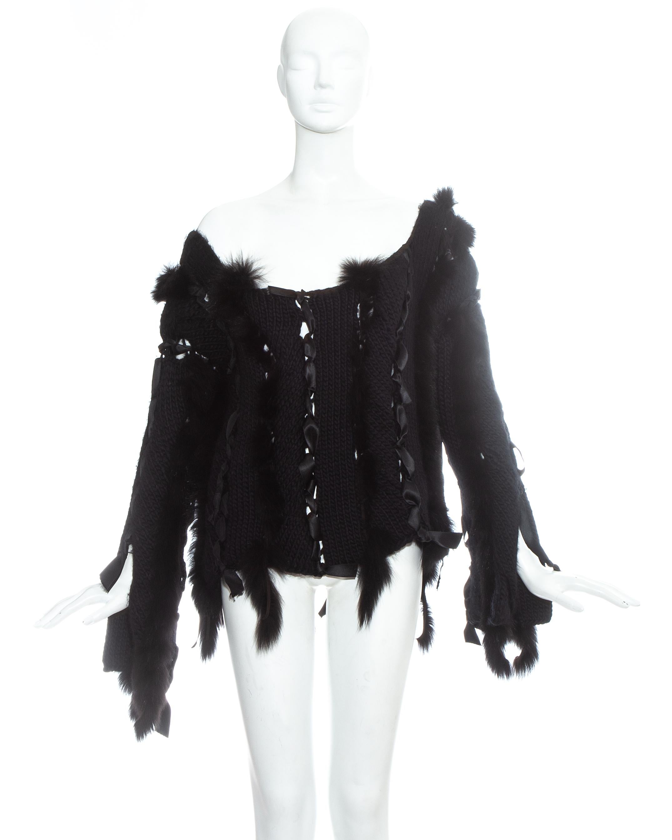 Gucci by Tom Ford black heavy knit oversized sweater woven with fox fur and silk ribbon.

Fall-Winter 2002