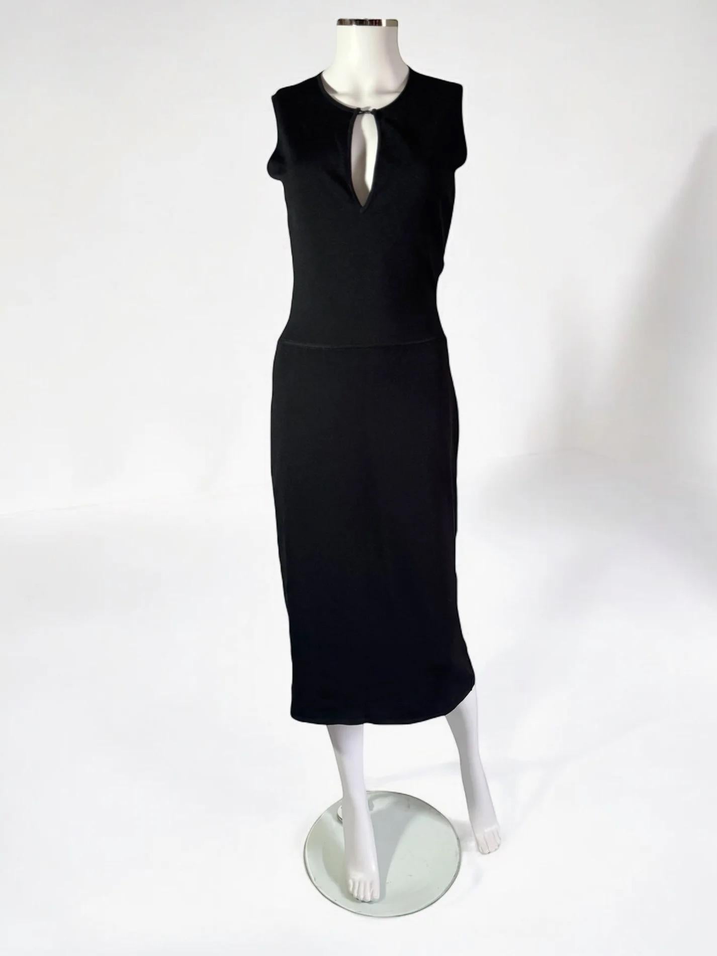 Gucci by Tom Ford black knit bodycon dress,  2000
Form fitting with keyhole cut out, accented by a small bar
83% rayon 17% polyester 
Size: L
