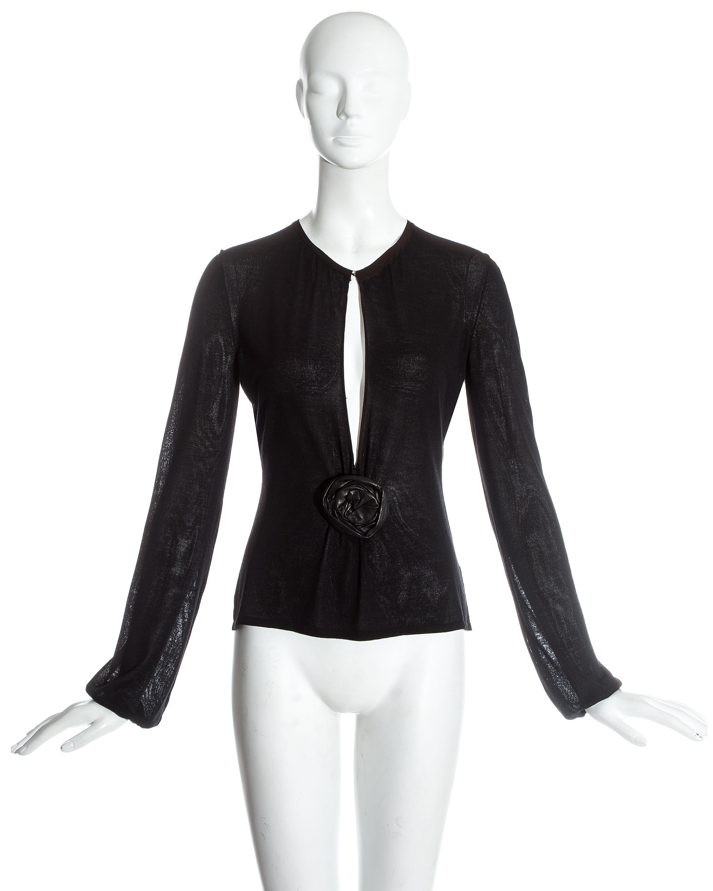 Gucci by Tom Ford black knitted evening blouse with peek-a-boo cleavage and leather rose

Fall-Winter 1999