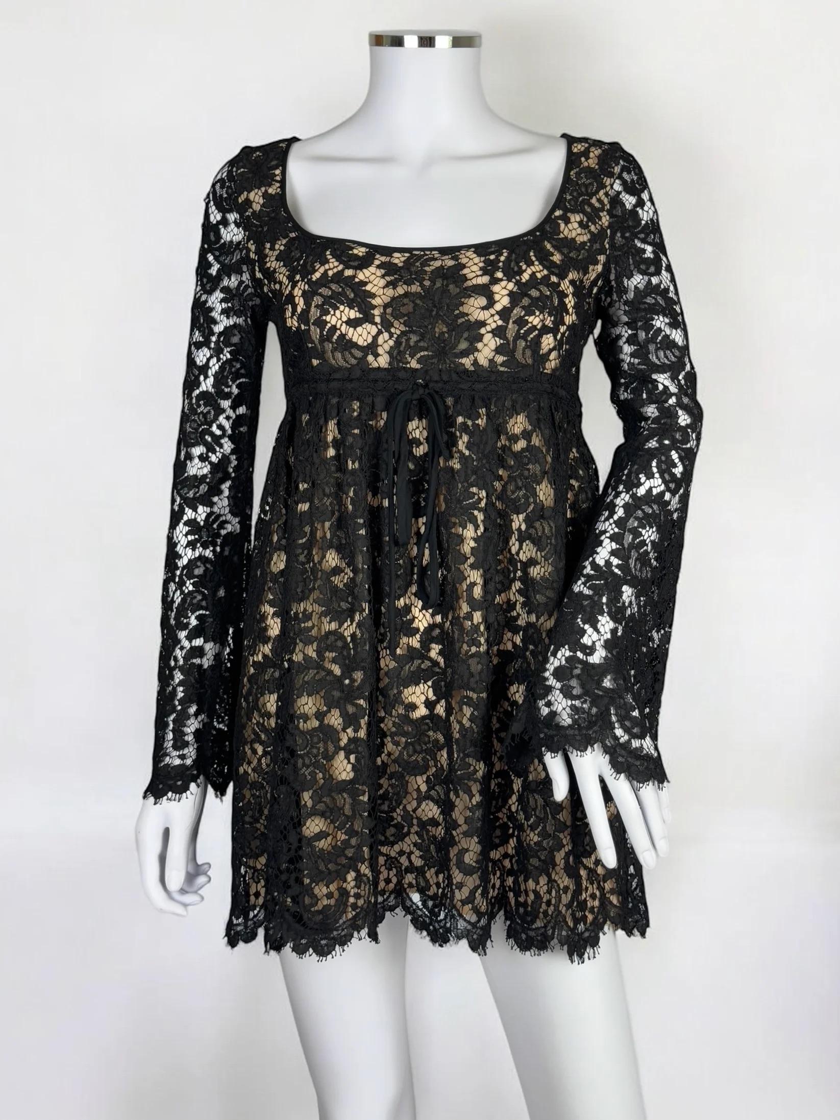 Gucci by Tom Ford black lace babydoll mini dress, Spring Summer 1996
Empire line bust which fastens with a tie before flowing out into a full bodied skirt, ultra-mini in length
Built-in nude slip dress giving the illusion of black lace over