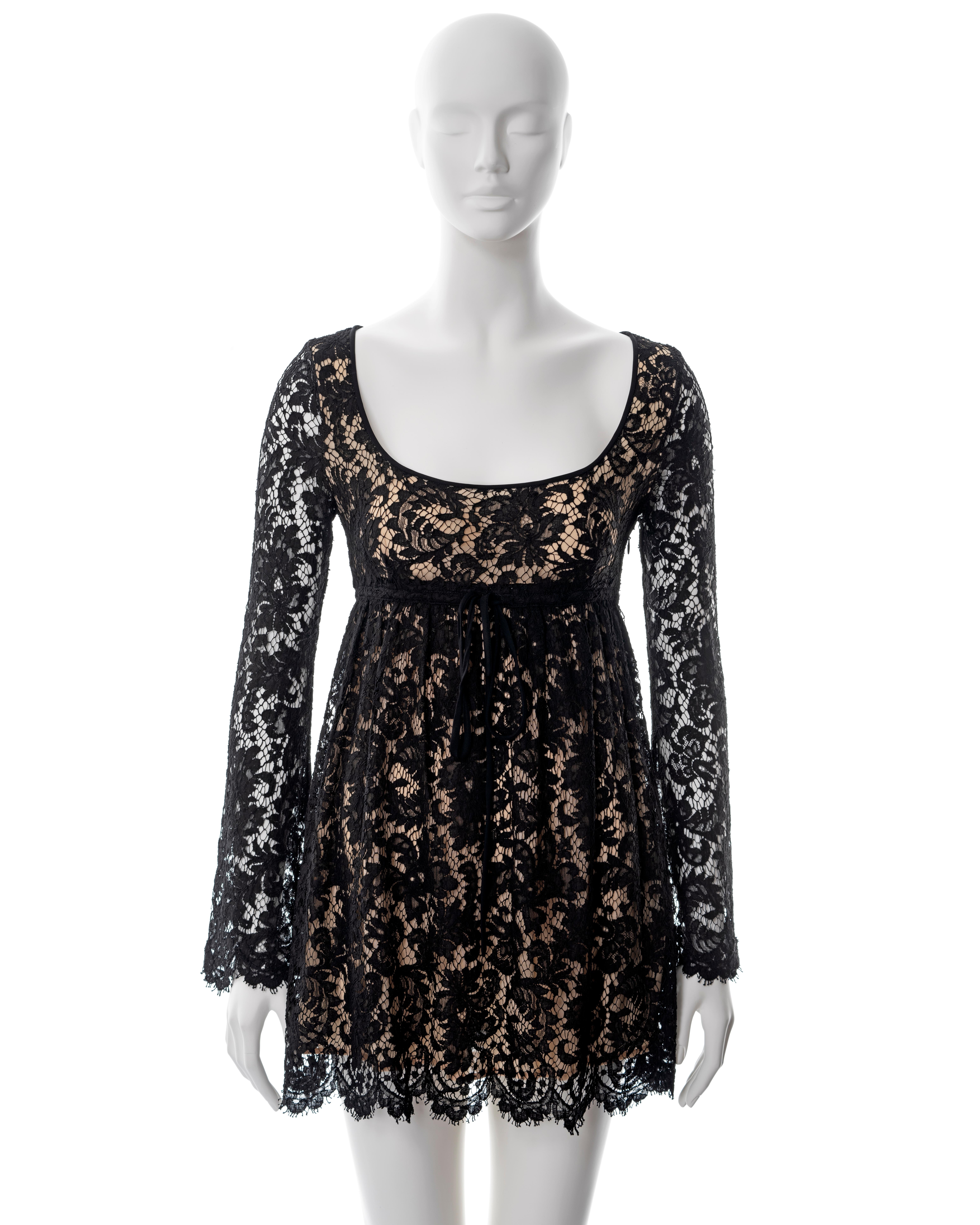 ▪ Gucci black lace mini dress
▪ Designed by Tom Ford
▪ Black Chantilly lace 
▪ Long flared sleeves 
▪ Scoop neck 
▪ Ribbon ties at underbust 
▪ Nude silk lining 
▪ IT 38 - FR 34 - UK 6 - XS
▪ Made in Italy

All photographs in this listing EXCLUDING