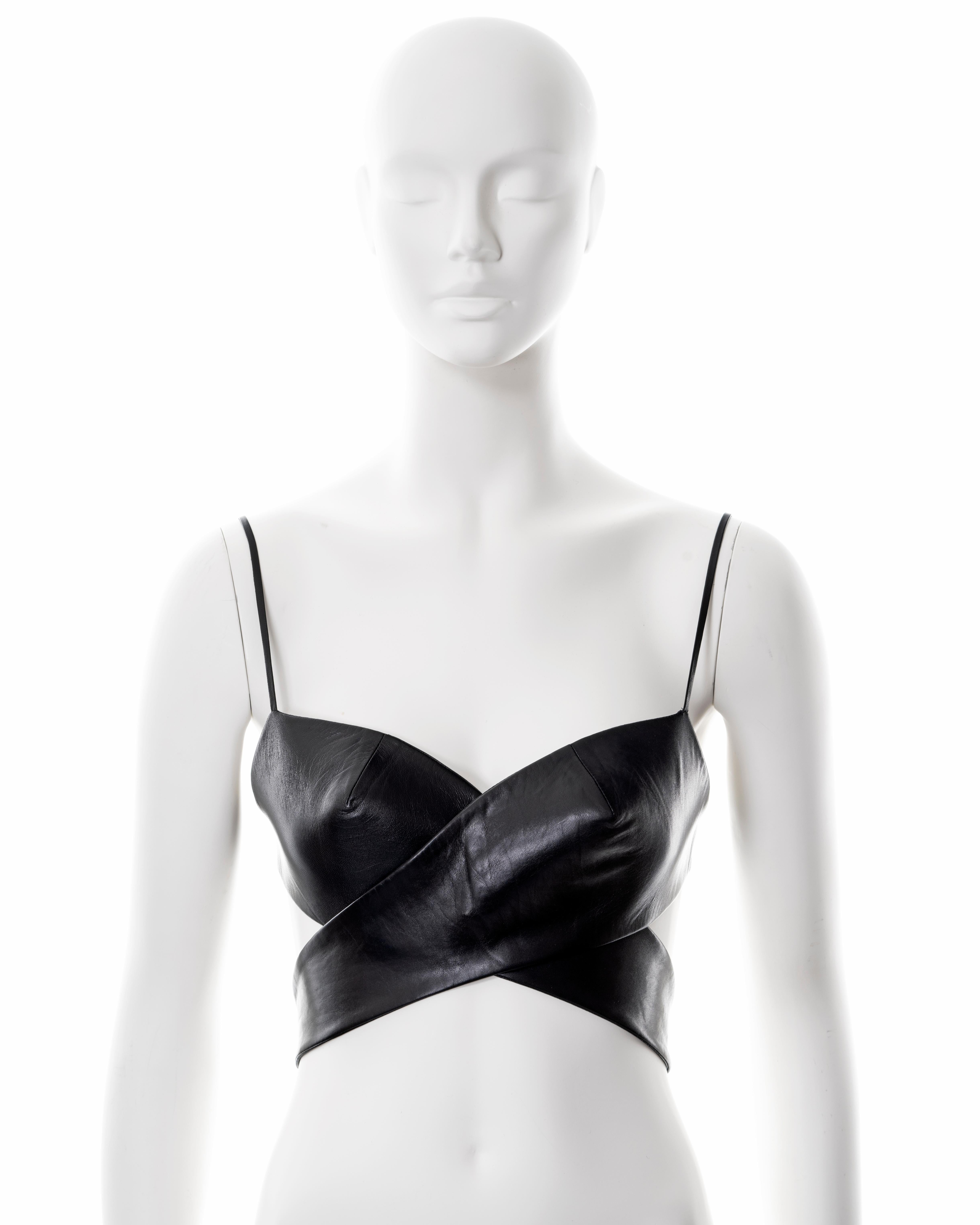 ▪ Gucci black leather bra top
▪ Designed by Tom Ford
▪ Sold by One of a Kind Archive
▪ Constructed from black lambskin leather 
▪ Consists of two single-cup bras which cross over when worn 
▪ Thin adjustable spaghetti straps with miniature buckles