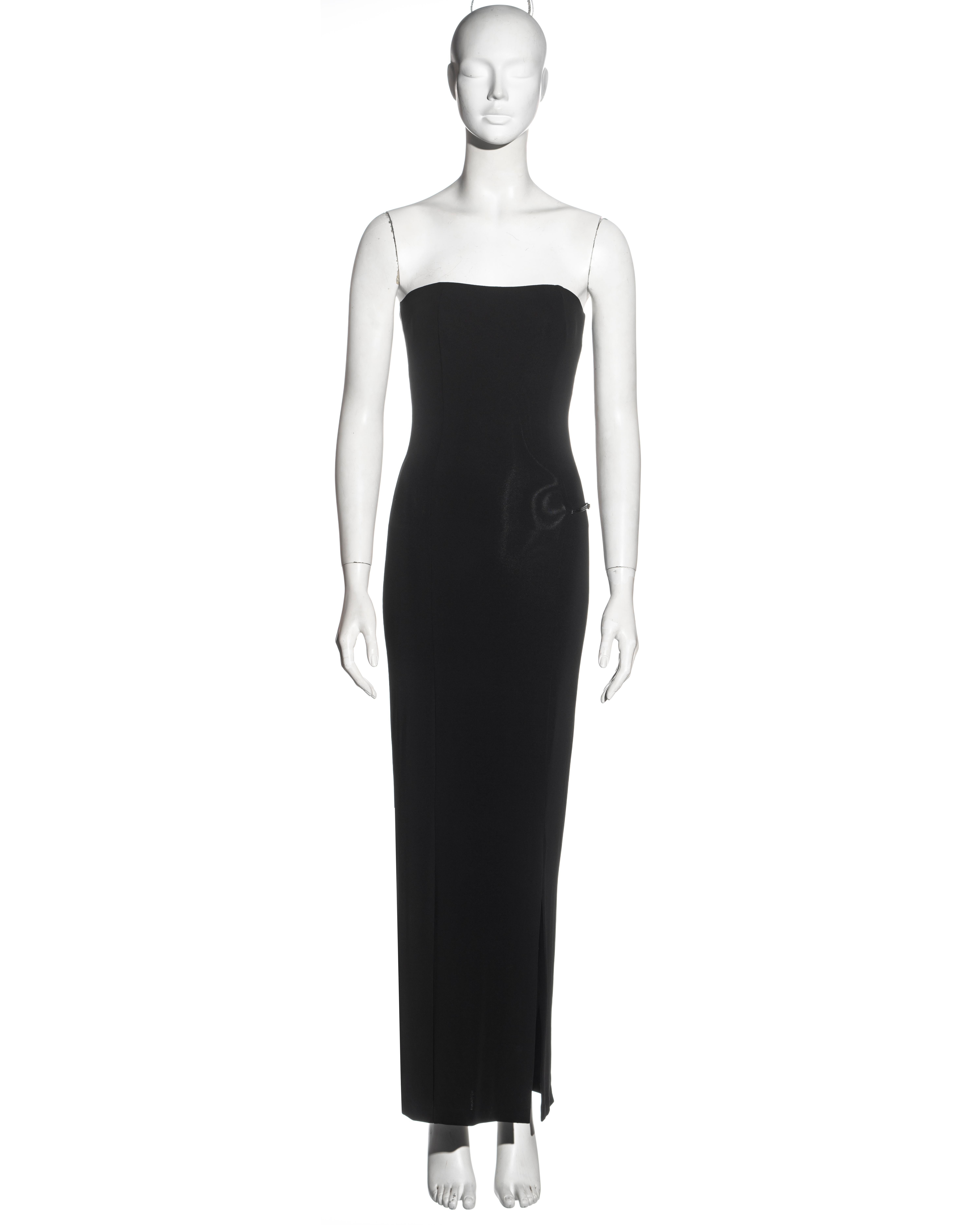 ▪ Gucci black strapless evening dress 
▪ Designed by Tom Ford 
▪ Fine rayon and spandex jersey 
▪ Leather strap with Gucci 'G' metal buckle 
▪ Leg slit 
▪ IT 40 - FR 36 - UK 8
▪ Spring-Summer 1998
▪ 94% Rayon, 6% Spandex
▪ Made in Italy