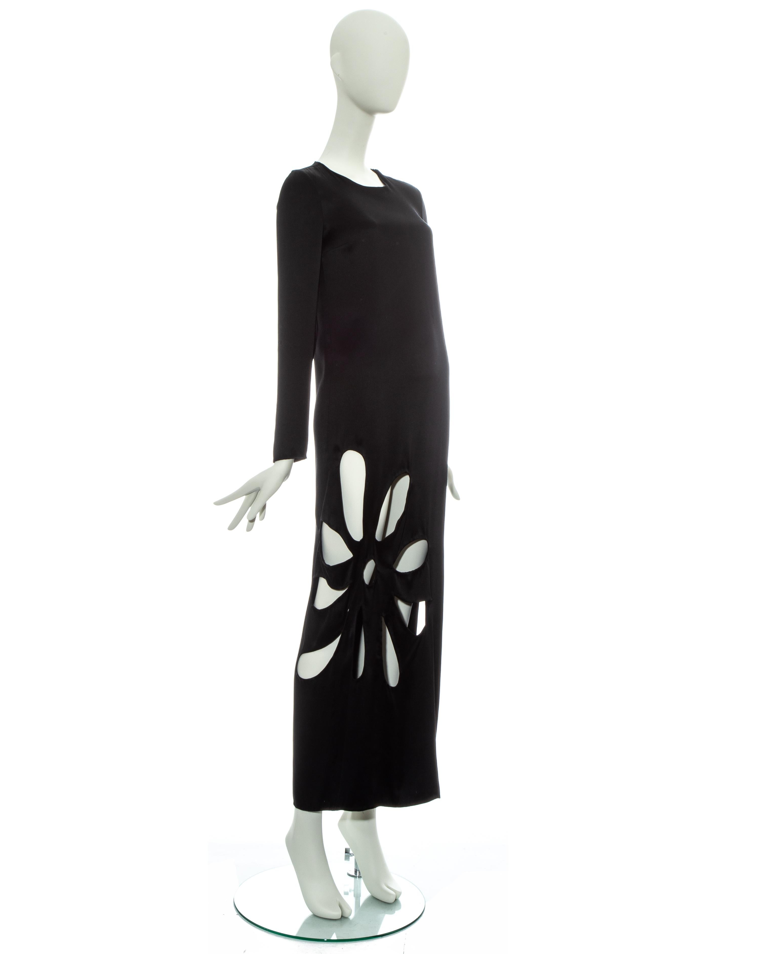 Gucci by Tom Ford black silk column dress with cut outs in the shape of a flower and leg slit on side seam

Spring-Summer 2002