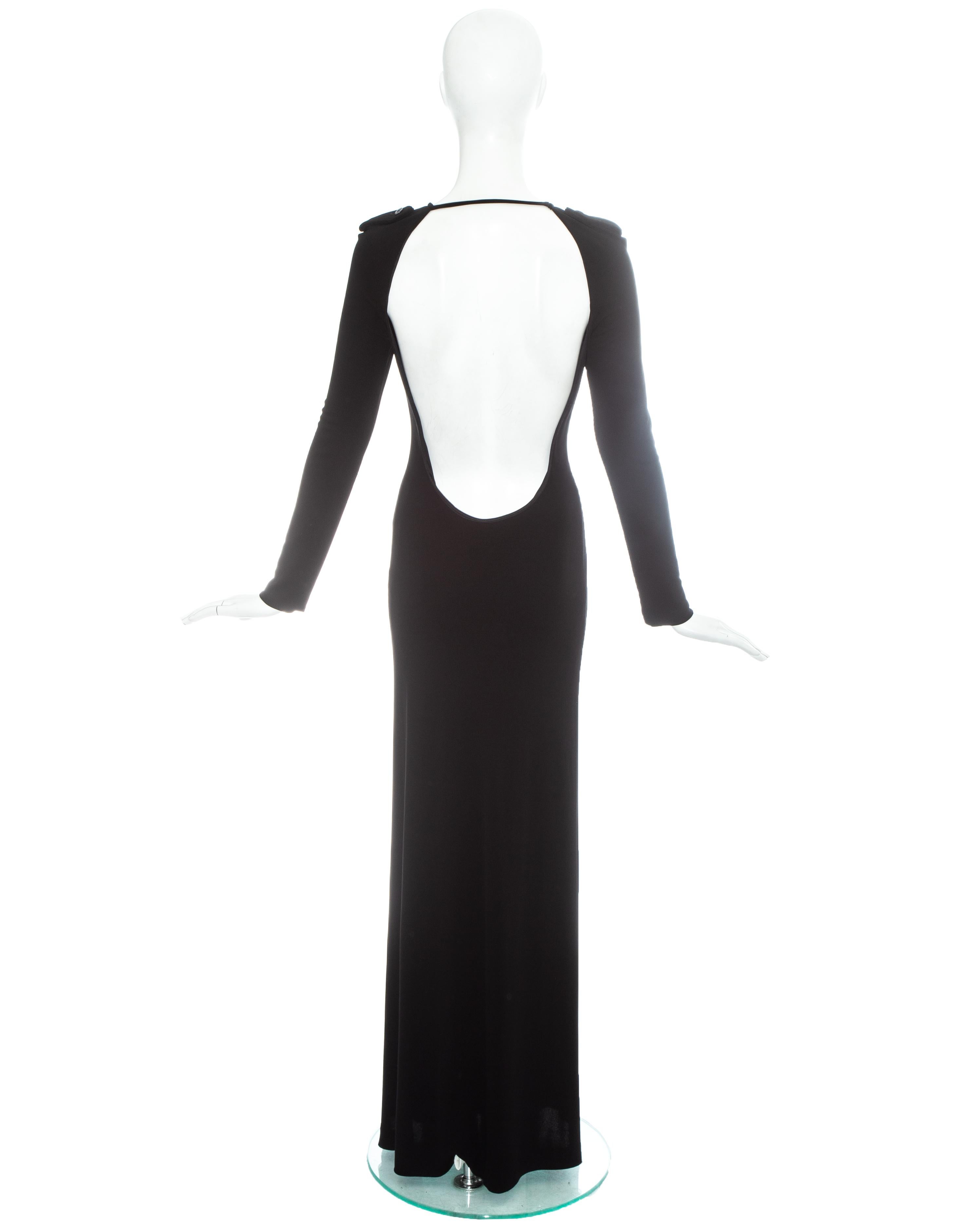 Gucci by Tom Ford black silk maxi dress with open back and epaulettes. 

Fall-Winter 1996