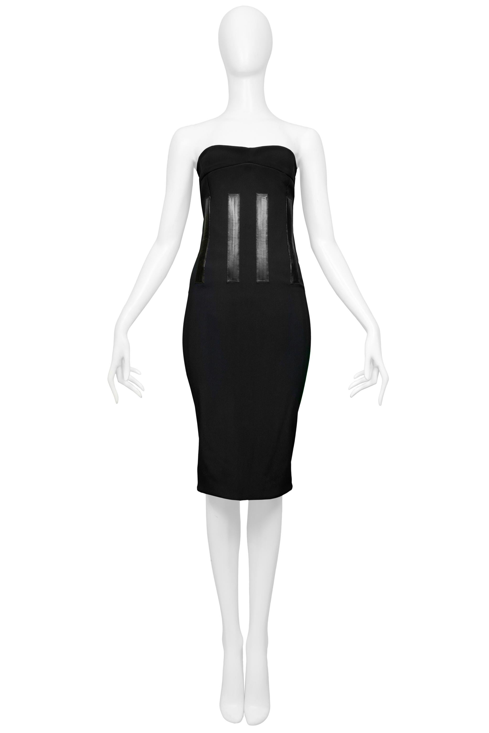 Resurrection Vintage is excited to offer a vintage black Tom Ford for Gucci strapless runway dress featuring a fitted body, leather detailing, and center back slit and zipper closure with Gucci pull.

Gucci
Designed by Tom Ford
Size 42 
2001