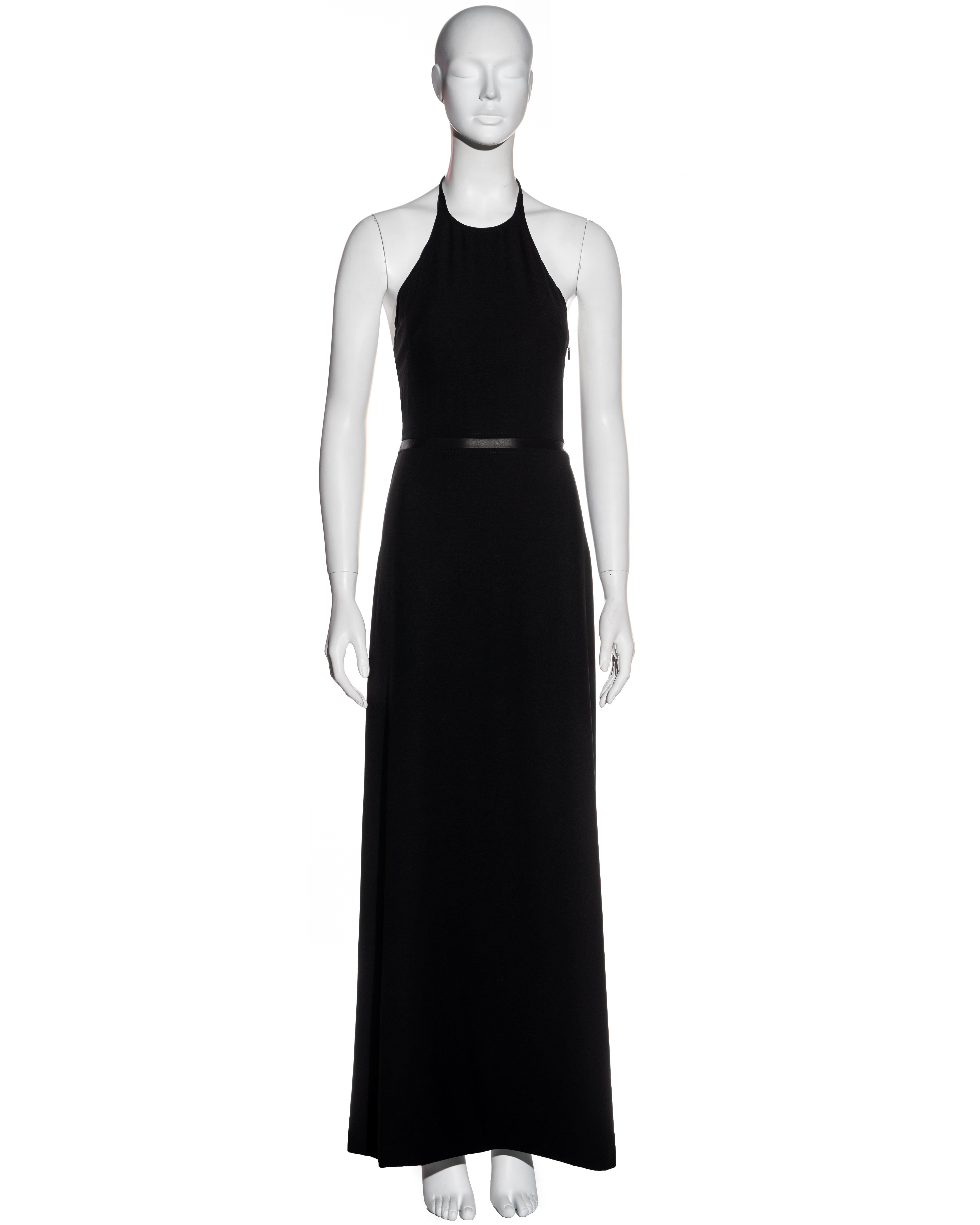 ▪ Gucci black wool halter neck maxi dress
▪ Designed by Tom Ford
▪ Black leather waistband 
▪ Fitted bodice
▪ A-line maxi skirt 
▪ Concealed zipper at side seam 
▪ Gold 'G' pendent detail
▪ New with tags
▪ IT 38 - FR 34 - UK 6 - US 2
▪ Fall-Winter