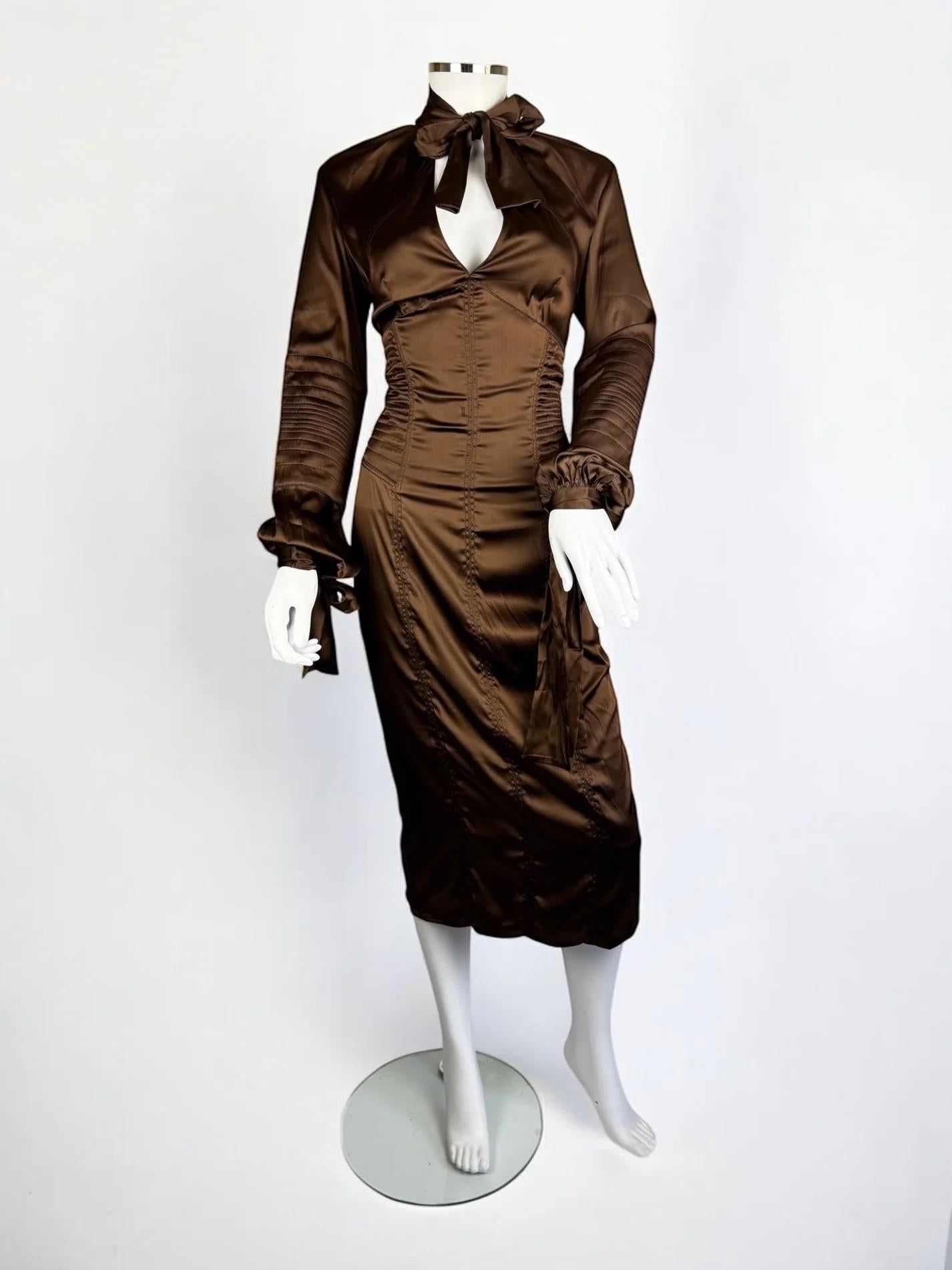 Gucci by Tom Ford brown silk mix dress, 2003
As worn by Jennifer Lopez on the cover of W Magazine in October 2003
Gorgeous form fitting dress with a sculpted figure, accented by a tied bow at the neck and at the cuffs
Classic provocative Tom Ford