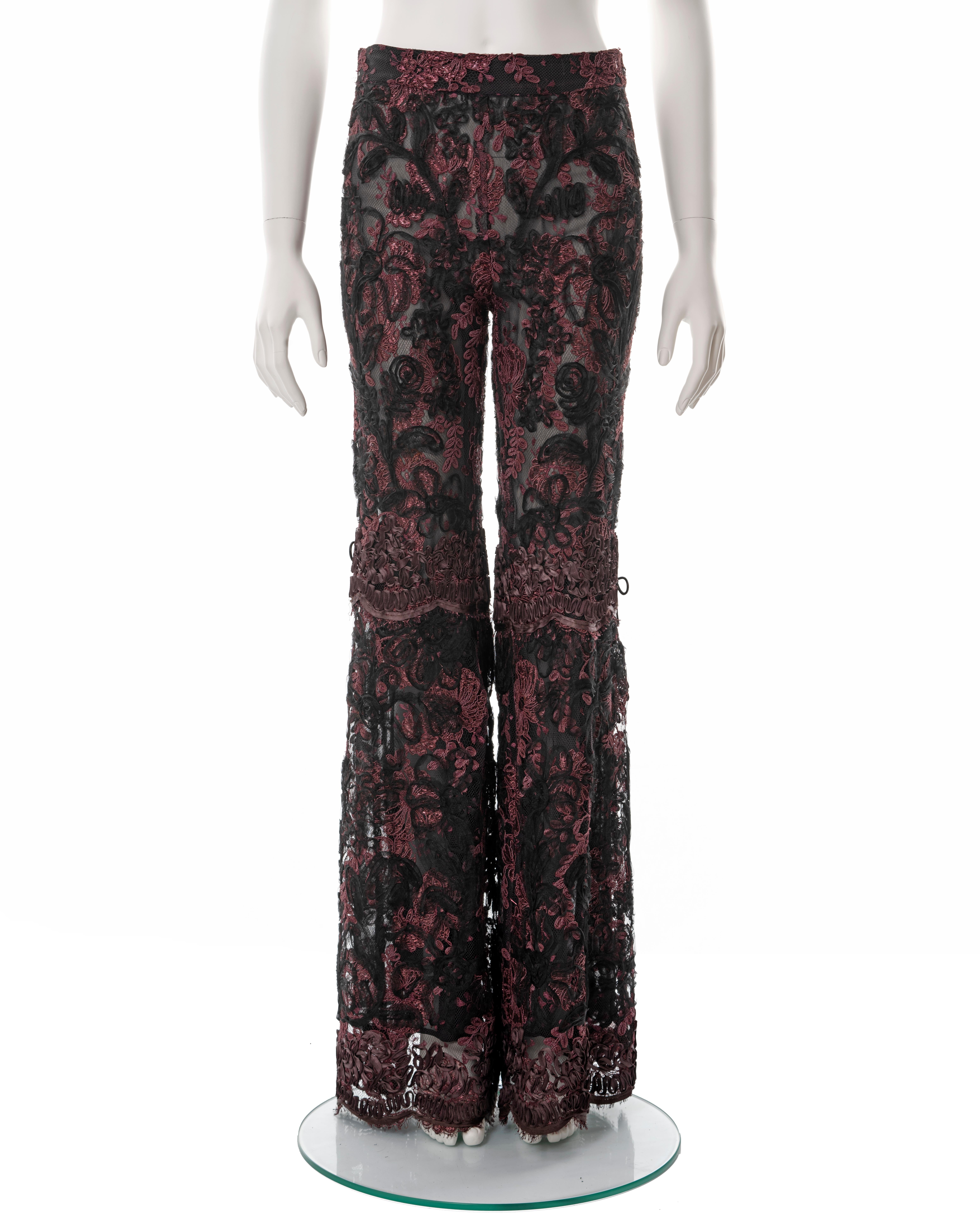▪ Gucci lace flared evening pants 
▪ Designed by Tom Ford
▪ Sold by One of a Kind Archive  
▪ Burgundy and black lamé floral lace
 ▪ Black ribbon embroidery 
▪ Leather bows at the knees  
▪ Silk chiffon lining  
▪ IT 46 - FR 42 - UK 14 - US 10 
▪
