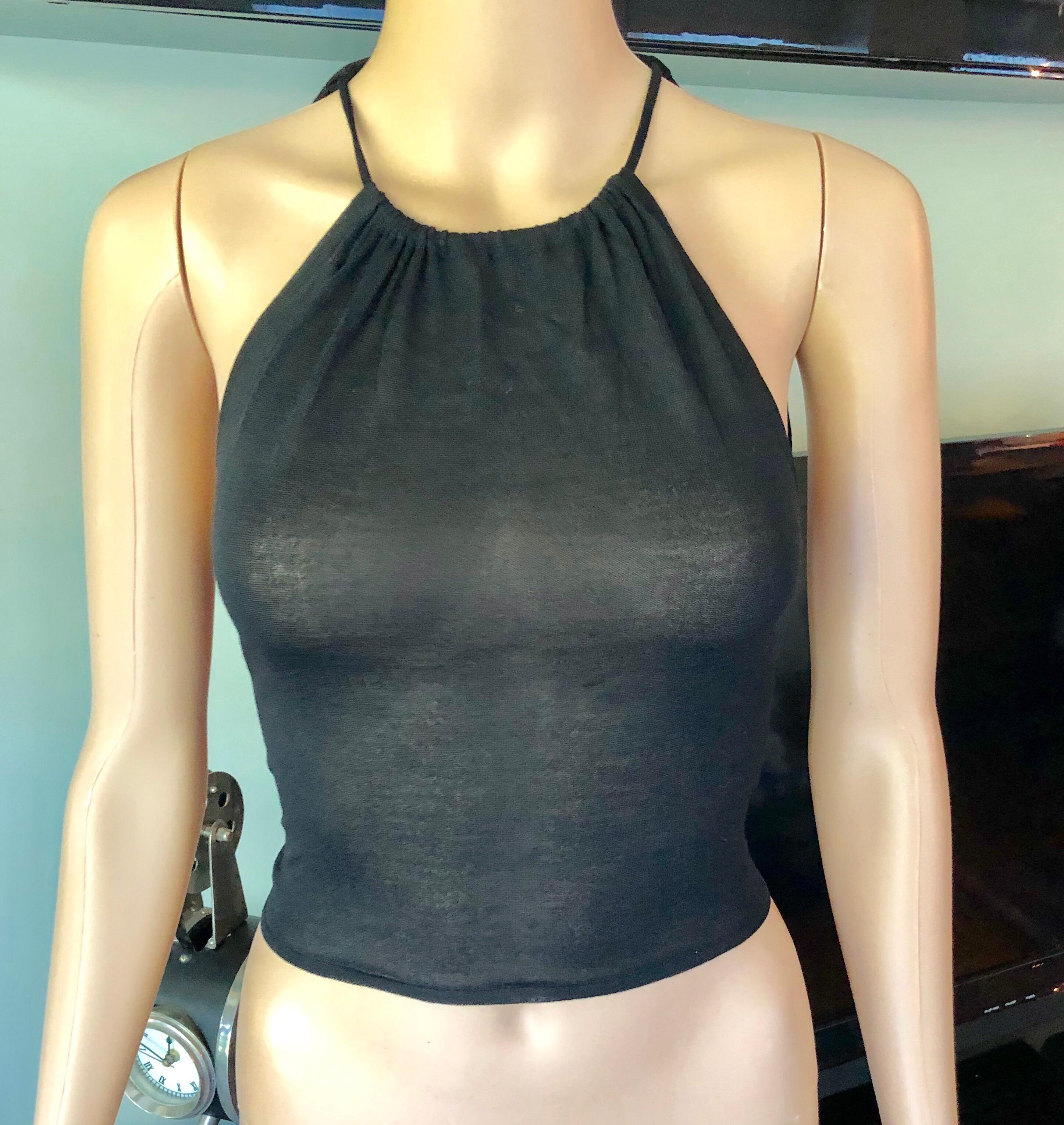 Gucci by Tom Ford c.2001 Silk Knit Halter Backless Black Crop Top

Gucci silk knit crop top with high neck, sash tie at back and silver-toned metal logo buckle at nape.
