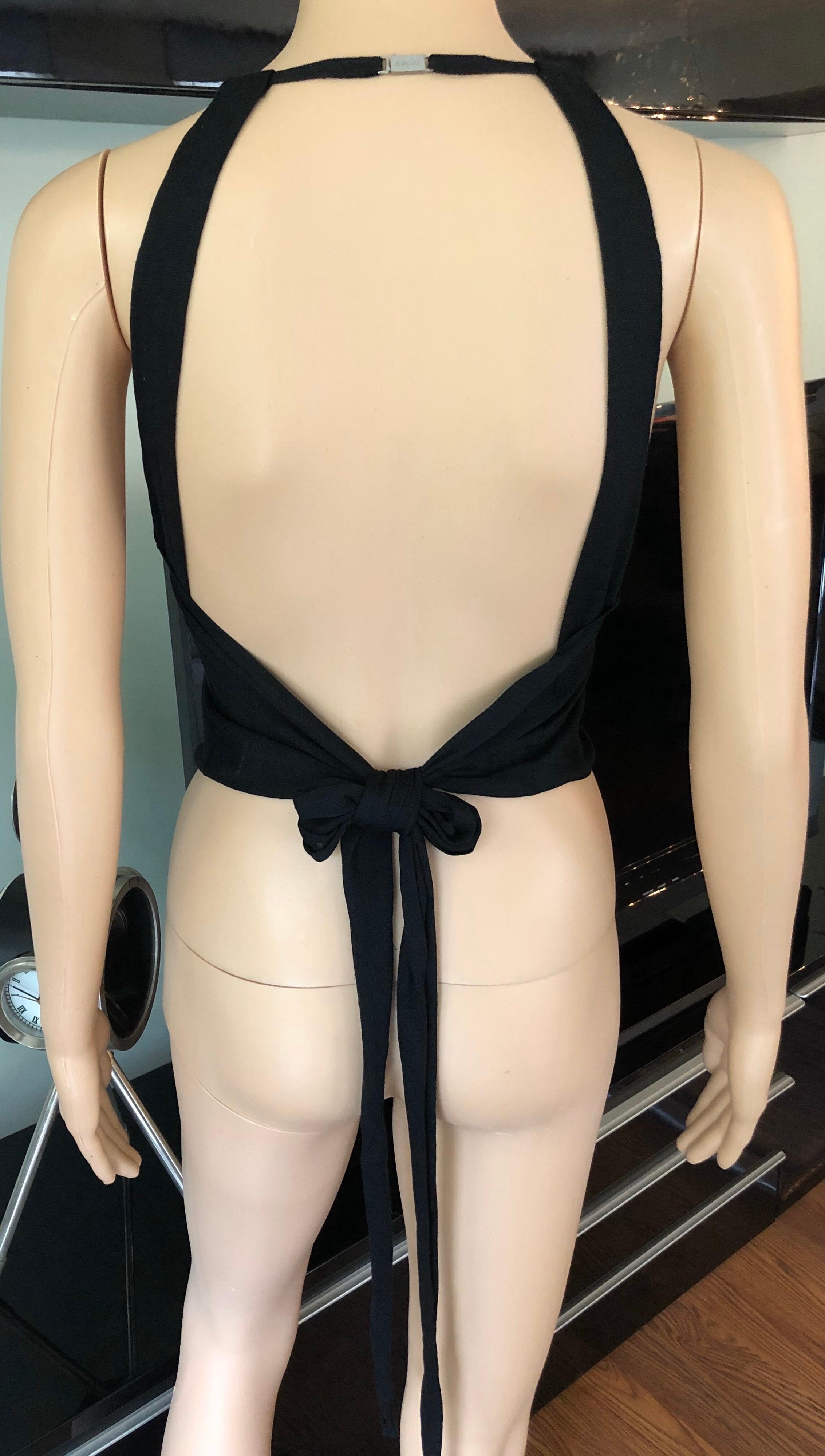 Gucci by Tom Ford c.2001 Silk Knit Halter Backless Black Crop Top

Gucci silk knit crop top with high neck, sash tie at back and silver-toned metal logo buckle at nape.