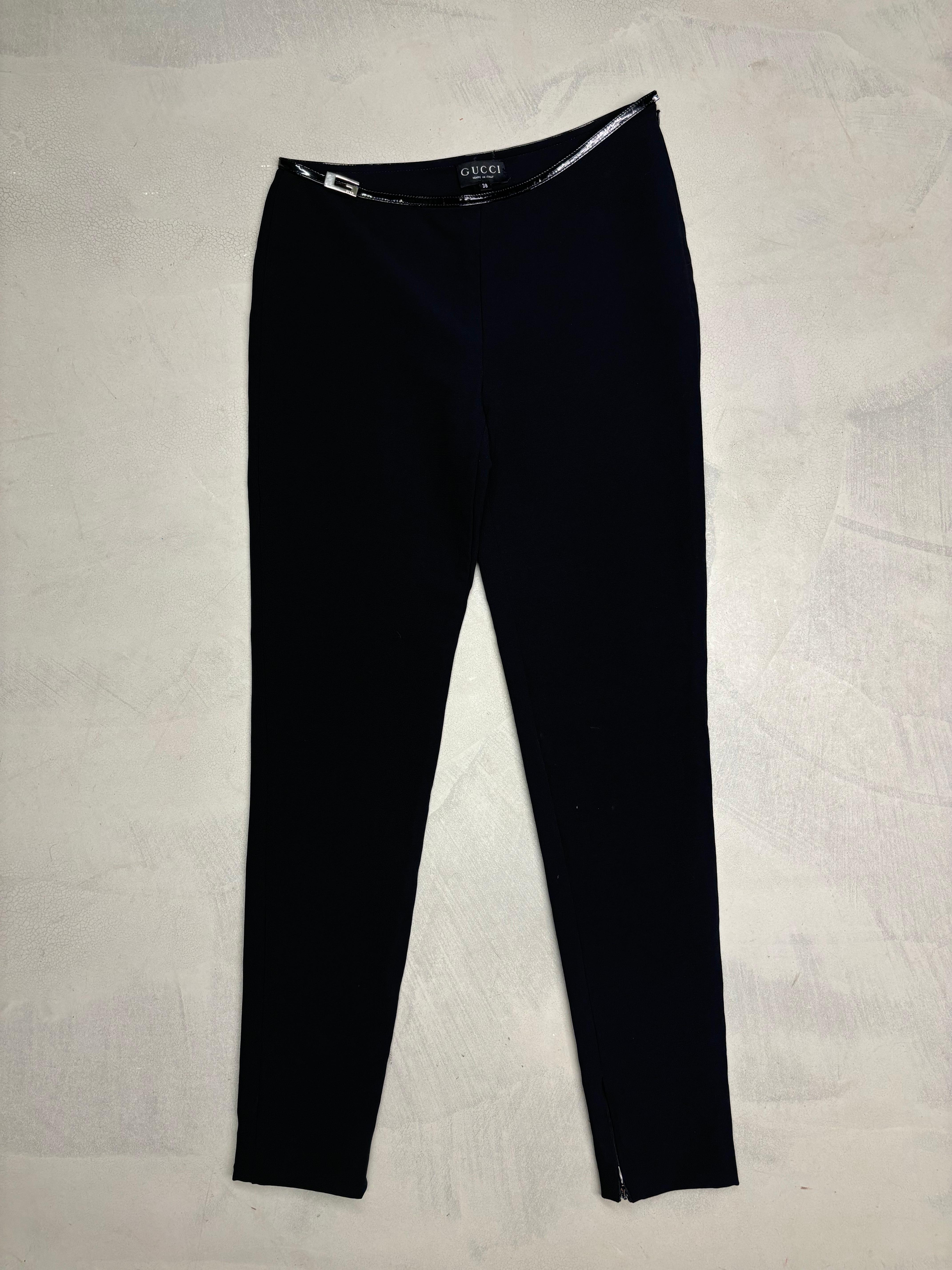 - Gucci by Tom Ford
- Fall Winter 1997 collection
- Black nylon skinny pants
- Asymmetrical waist with vinyl trim
- Side logo buckle 
- Ankle zippers
- Size: it 38
- 44% nylon 25% rayon 24% wool 7% spandex

Measurements (flat):
Waist - 36cm / 14.1