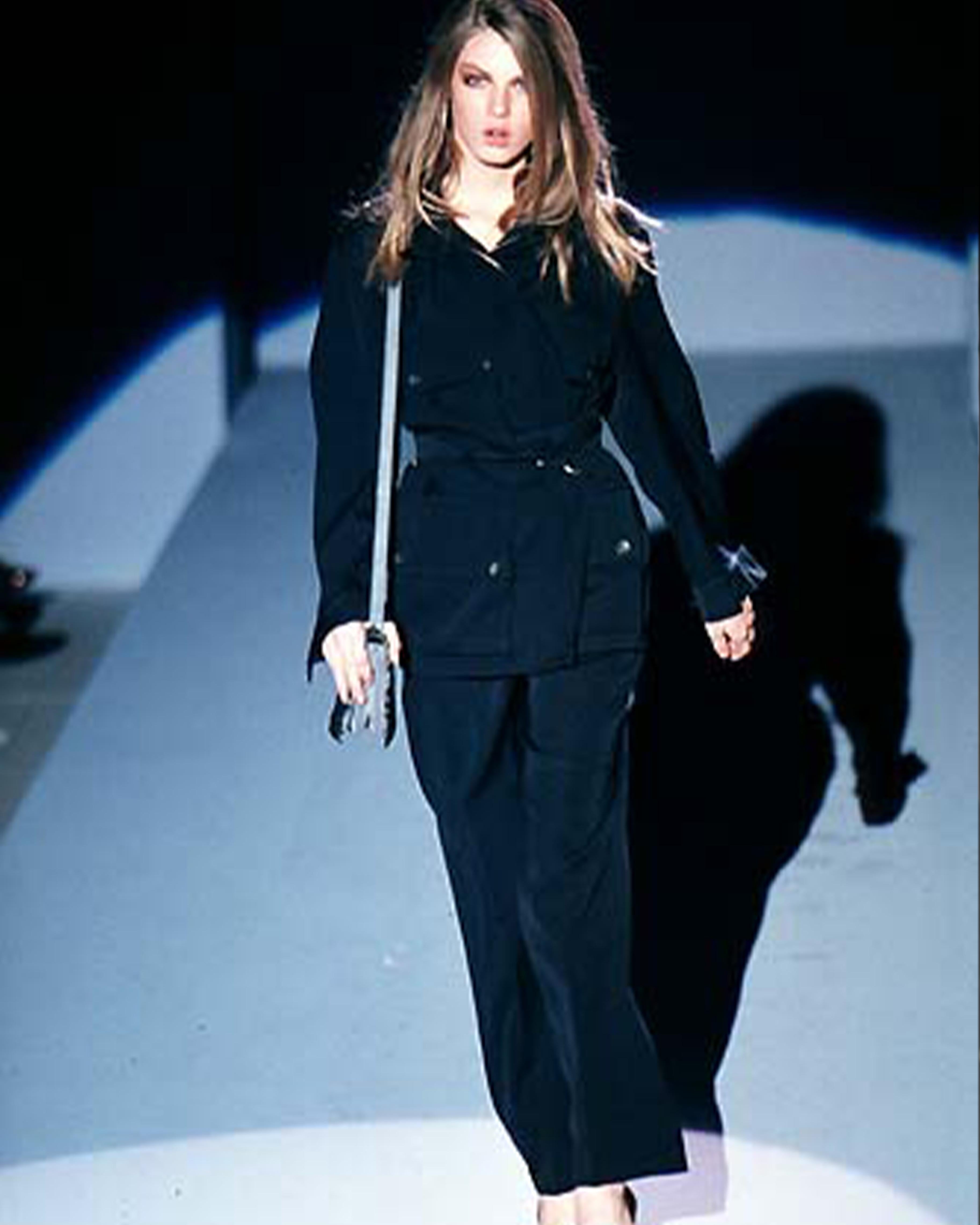 - Designed by Tom Ford
- Fall Winter 1998
- Runway piece
- Multipocket Black Jacket
- Belt closure at the neckline
- Four giant pockets on the front
- Button up and zip front closure
- Oversized fit
- Excellent condition
- Made in Italy
- Materials: