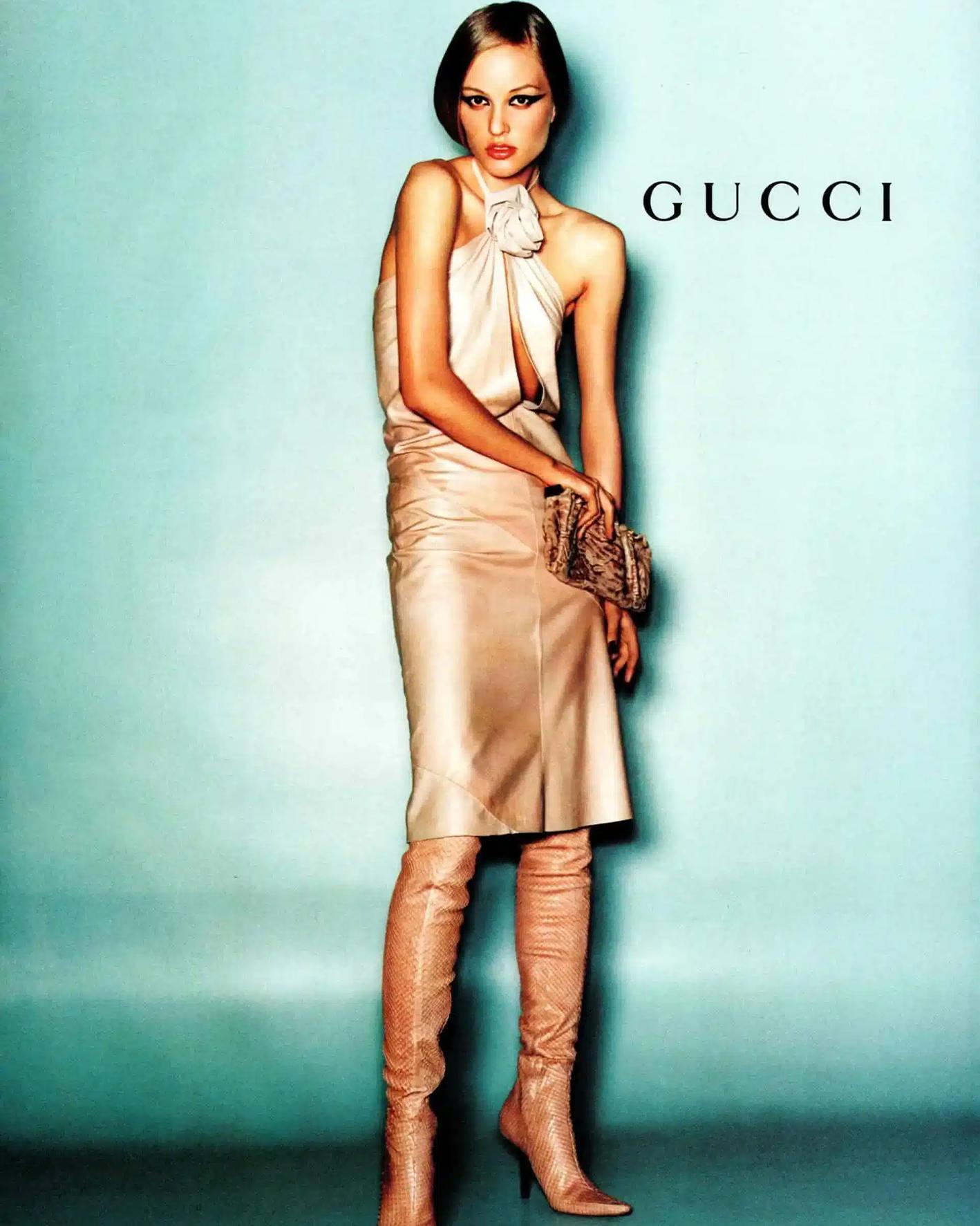 Designed by Tom Ford
Sold by Skof.Archive
Fall Winter 1999 Dress
Runway Piece
Halter neck leather mini dress
Sleeveless
Open back design
Vertical open line on the front
Gucci leather rose choker with silver hardware 
Excellent condition
Made in