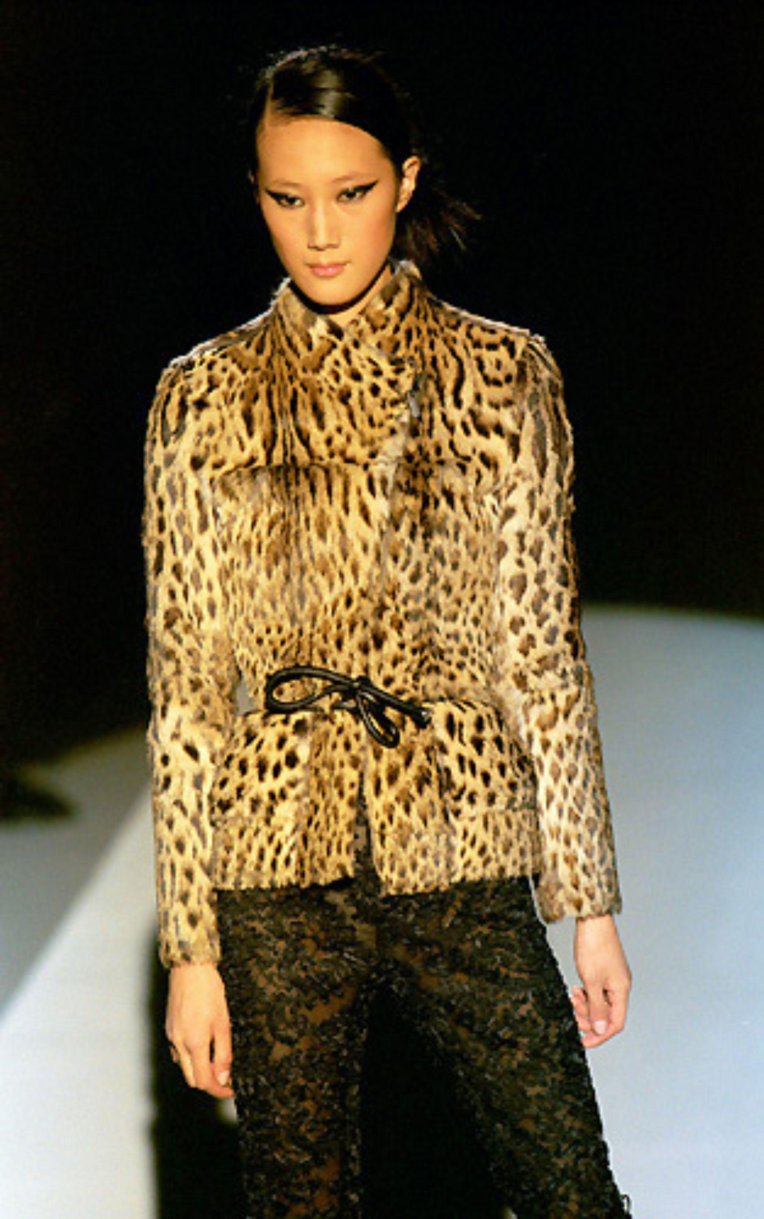 Vintage Gucci 
By Tom Ford
Fall 1999 - seen on the runway, in campaign images and in Vogue US September 1999 issue

Leopard print fur jacket with leather cord belt
Black leather lining
Hidden zip
Zip up cuffs
Flap pockets on front

Size IT 42 / UK