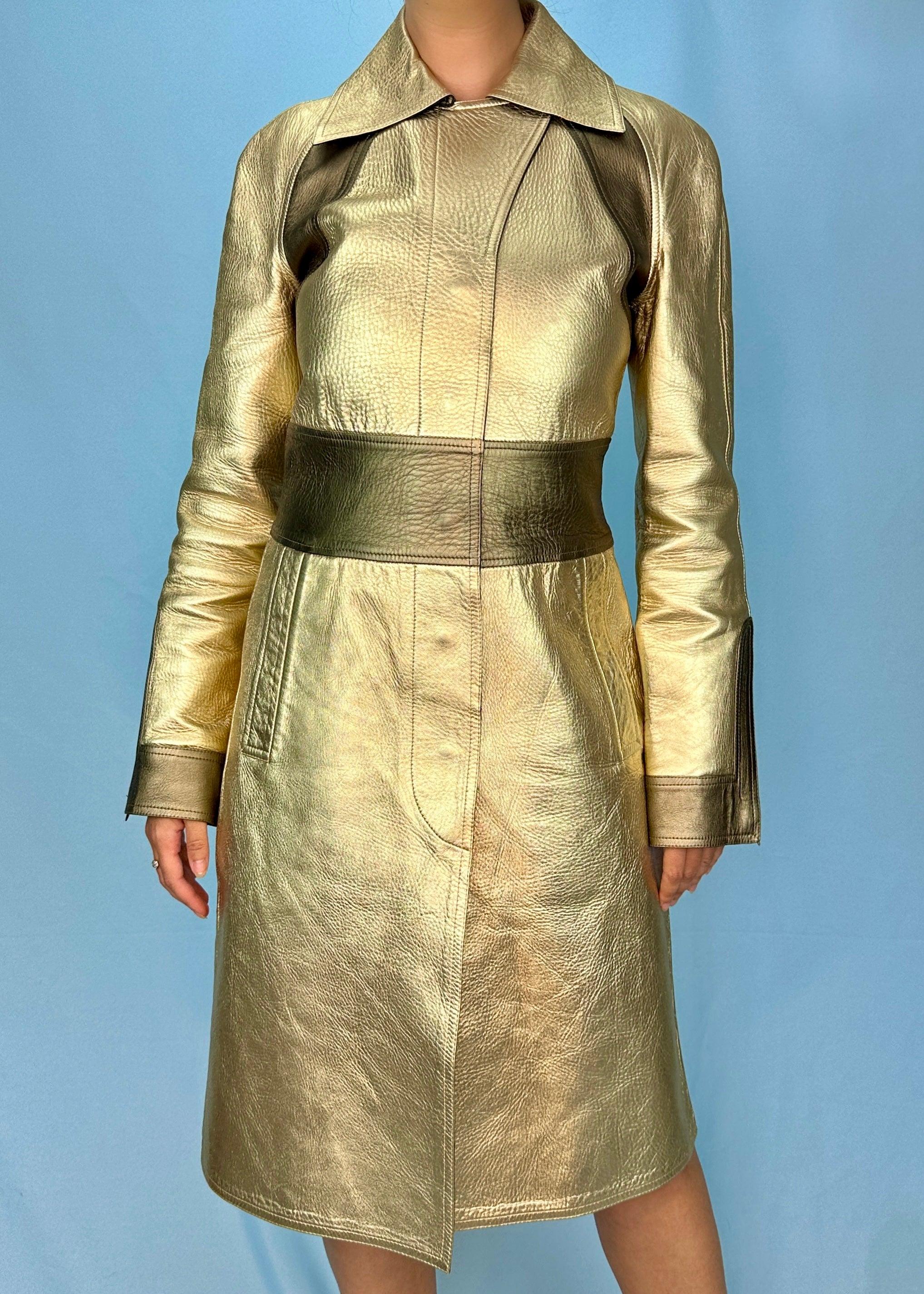 Vintage Gucci
By Tom Ford
Fall 2000 - seen on the runway and in campaign image

Metallic gold two tone leather jacket
Concealed popper buttons
Zips on each cuff
Back vent slit

100% leather

No size tag, fits as approx IT 40 / UK 8 / US
