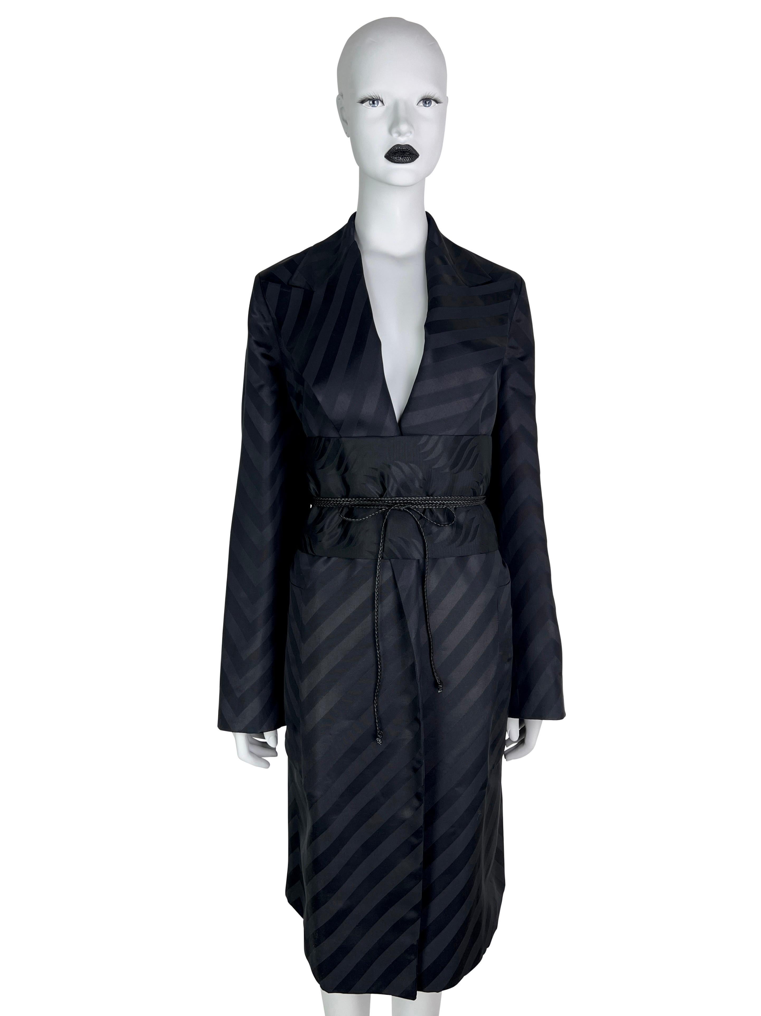 As seen on the runway, this stunning kimono-style coat can be worn as an open coat as it doesn’t have a closure (see the runway look with trousers), or as in the original look with a matching obi-style silk belt with leather straps. 


We are happy