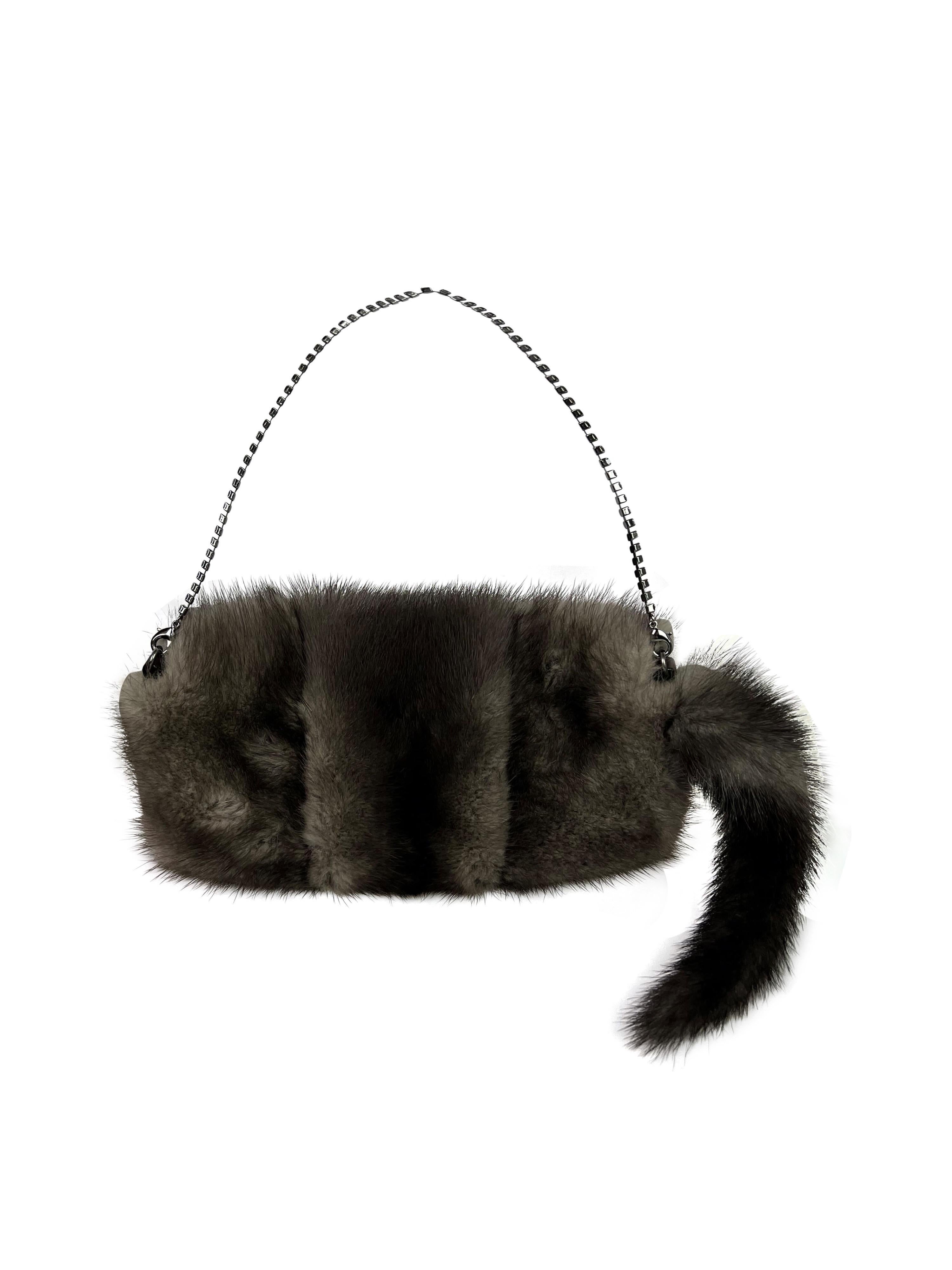An iconic mini bag with a Swarovski chain handle and a stunning embellishments, made out of genuine mink fur.

The bag is in an excellent vintage condition with a faint lipstick stain on the inside *please see the photo. 

Height: 10 cm (4
