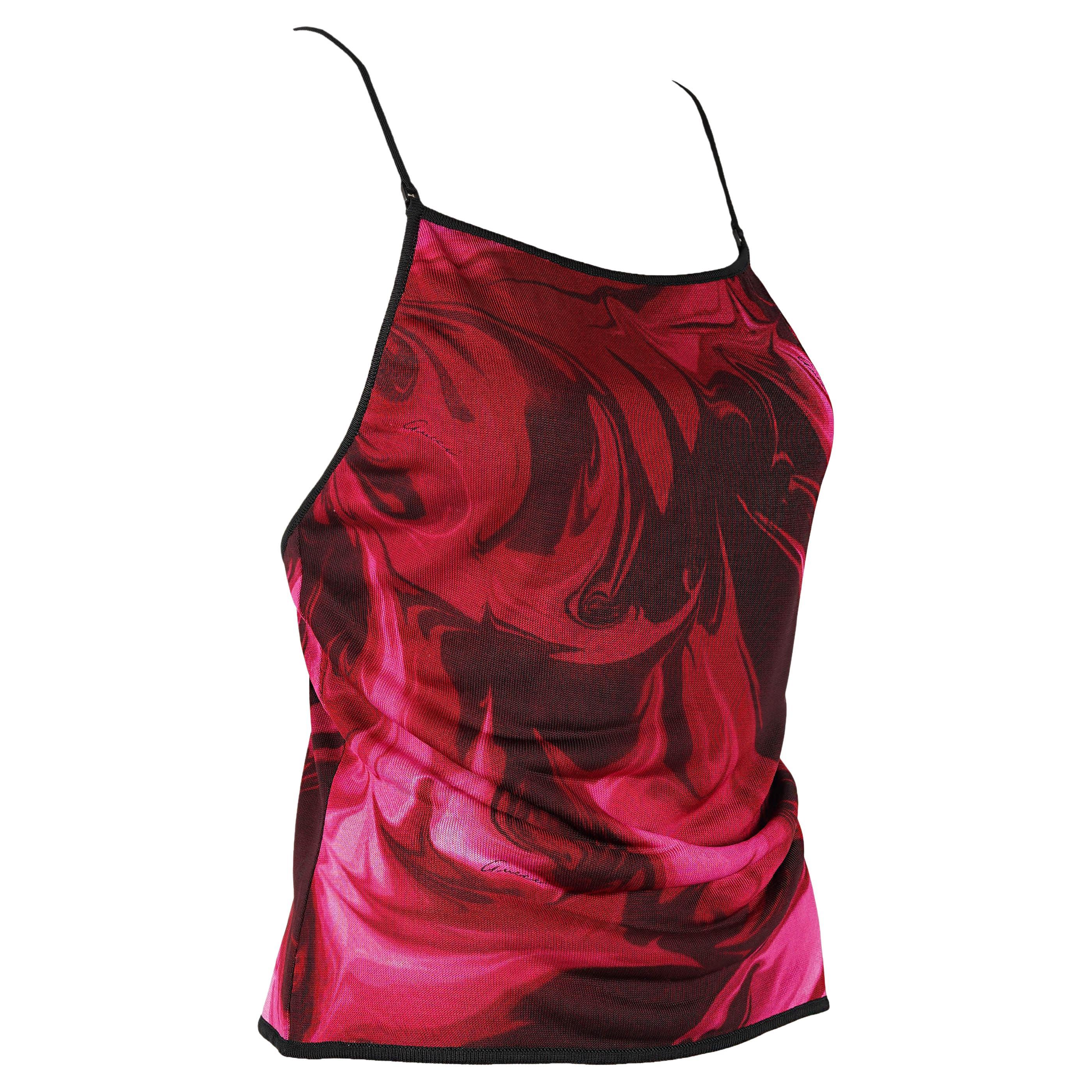 A rare and highly collectible piece from Gucci by Tom Ford’s Fall/Winter 2001 collection, this lava print top perfectly encapsulates the designer’s magnetic vision of early-2000s glamour — sleek, sensual, and unapologetically bold.

Made in Italy