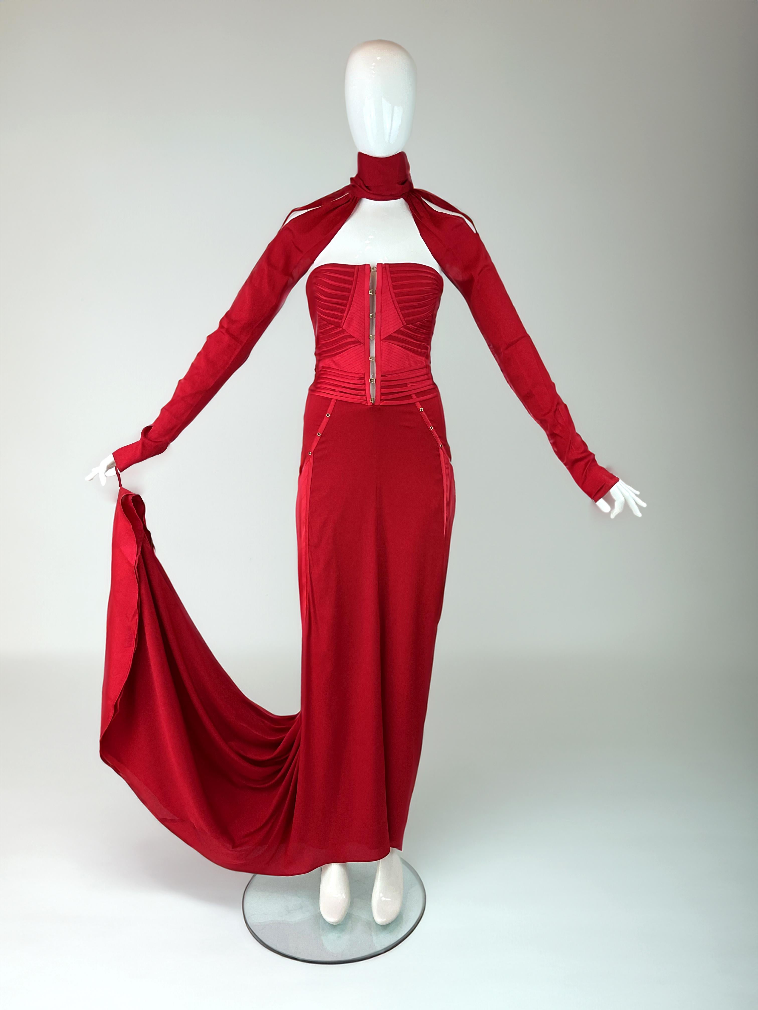 A truly iconic piece from fashion history, this red silk gown is the legendary final look from Tom Ford’s Fall/Winter 2003 collection for Gucci. Traditionally reserved for the most important design, the closing runway look is a moment of theatrical