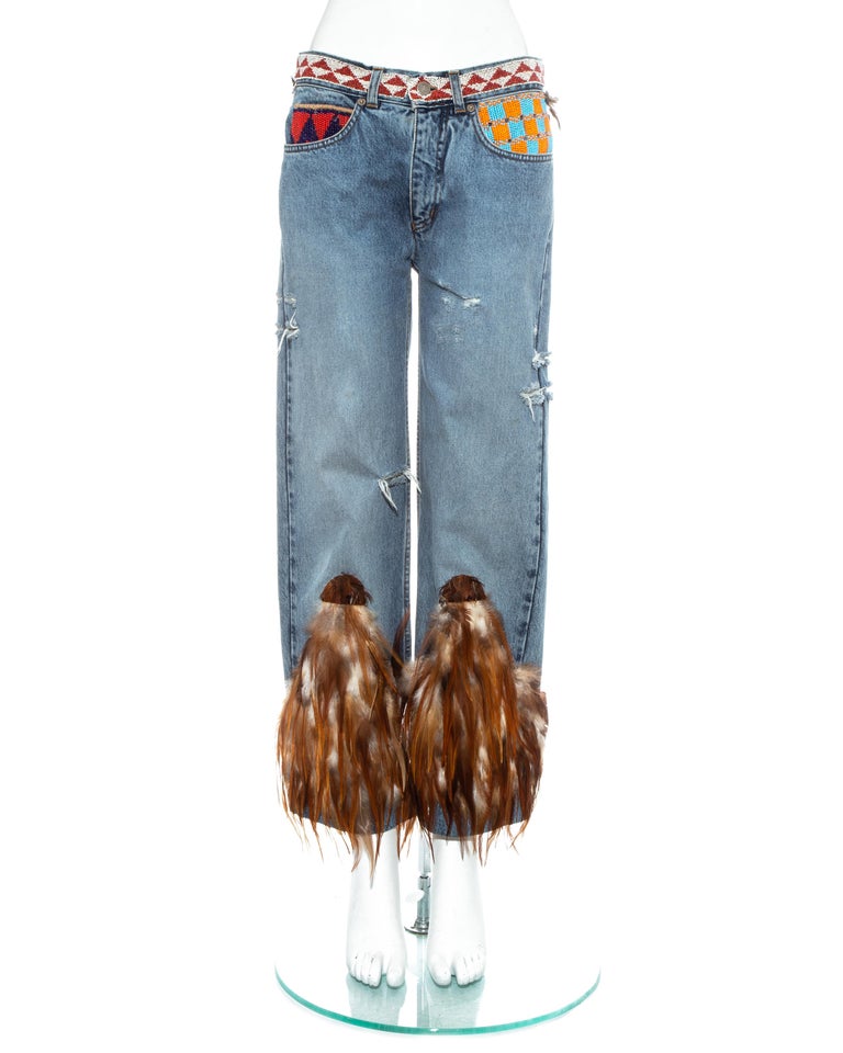 Gucci by Tom Ford iconic denim jeans with feathered hem and beaded pockets and waistband. Extremely rare design, only a small amount were produced. 

Spring-Summer 1999