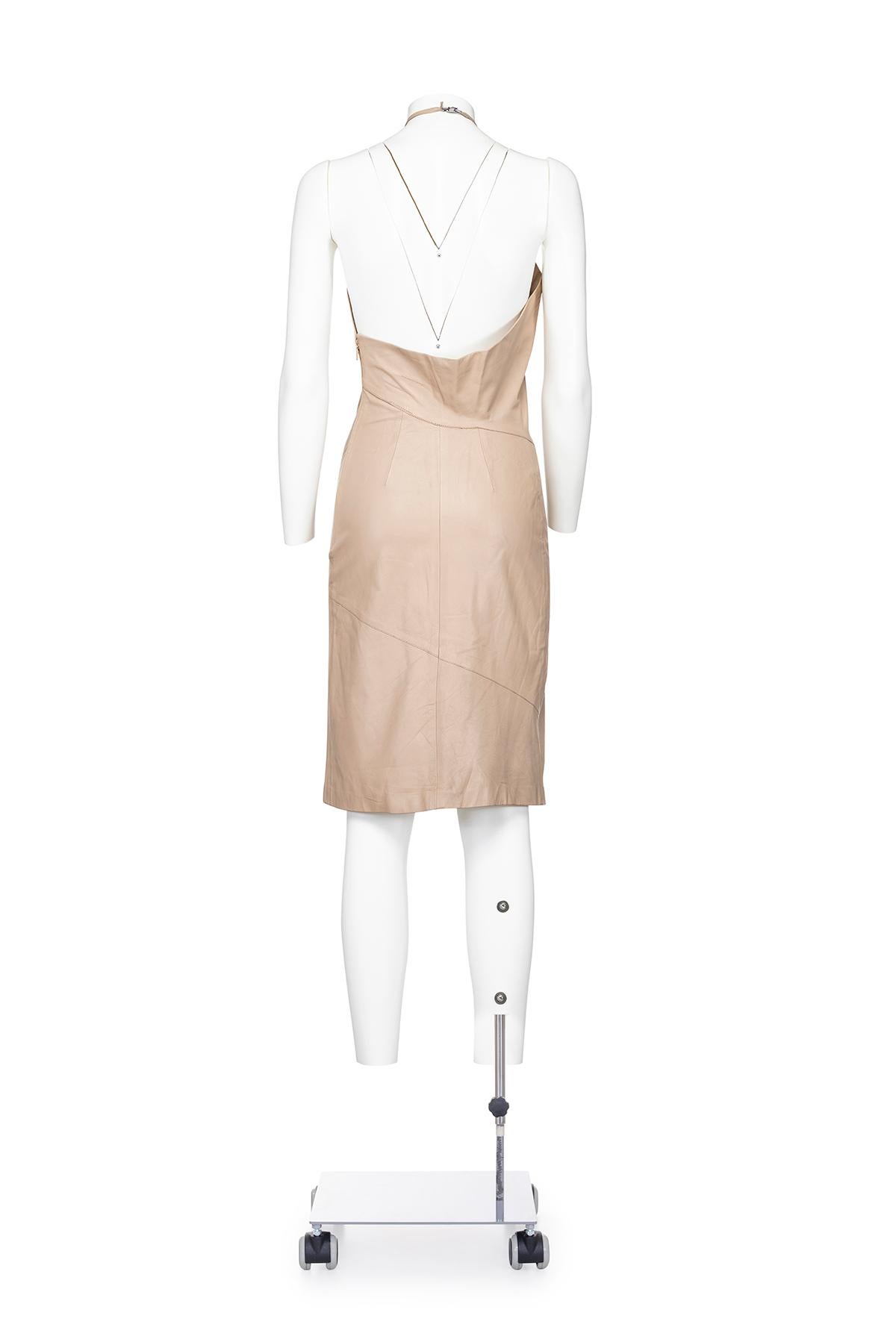Fall Winter 1999 Iconic halter neck leather minidress from Gucci by Tom Ford.
Floral detail on neckline
Side zipper closure
The composition is 100% leather