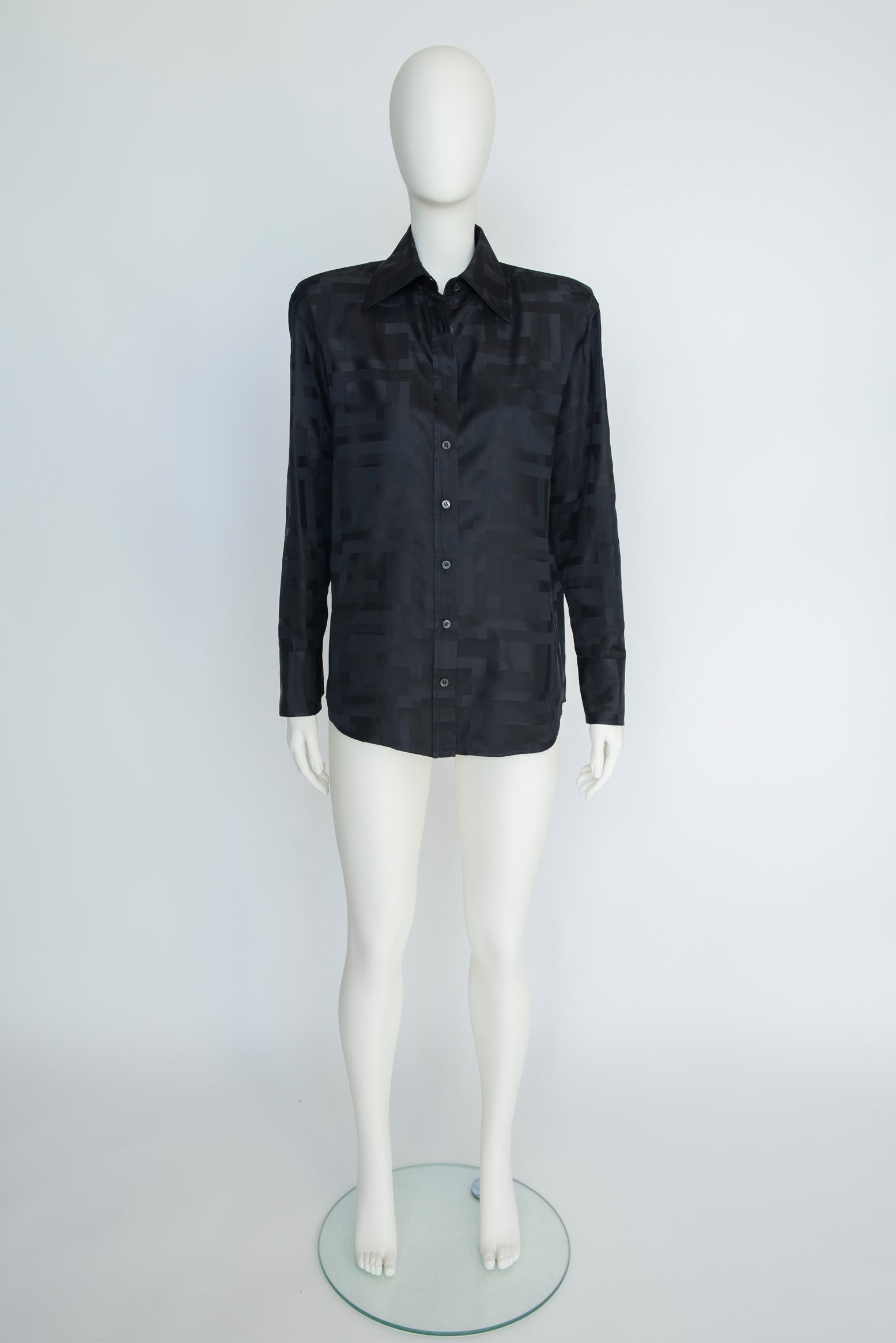 Chic and timeless, this black shirt from the iconic 1998 Spring-Summer Gucci by Tom Ford collection will prove to be a staple in any wardrobe. Jacquard-woven with lustrous squares GG logo throughout, the shirt features a point collar and buttoned