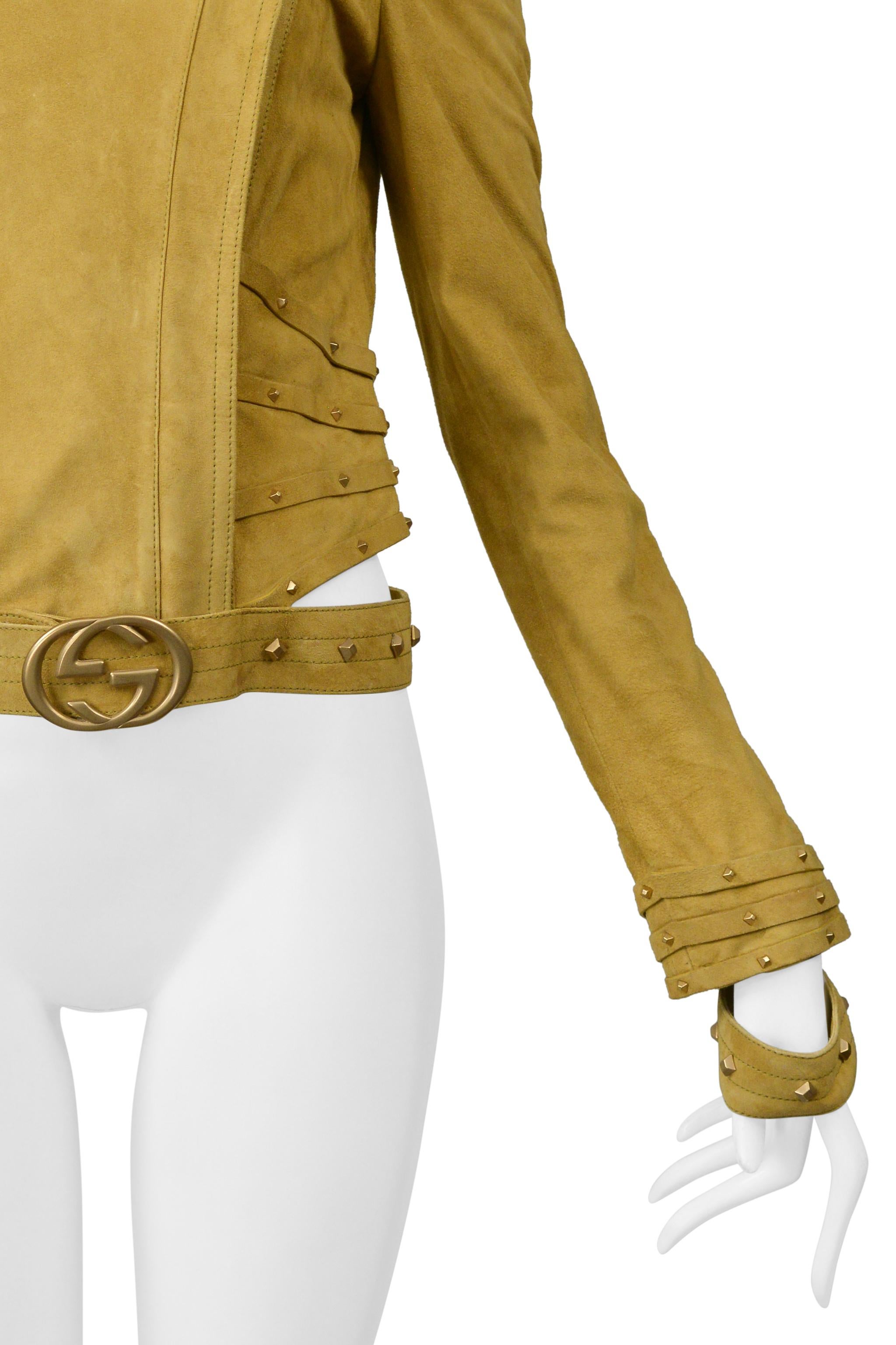 Resurrection Vintage is excited to offer a vintage gold suede Tom Ford for Gucci moto jacket featuring a diagonal zipper, collar, cuff and waistband cutouts, gold studs, bondage strap detailing, and a high neck. 

* Gucci
* Designed by Tom Ford
*