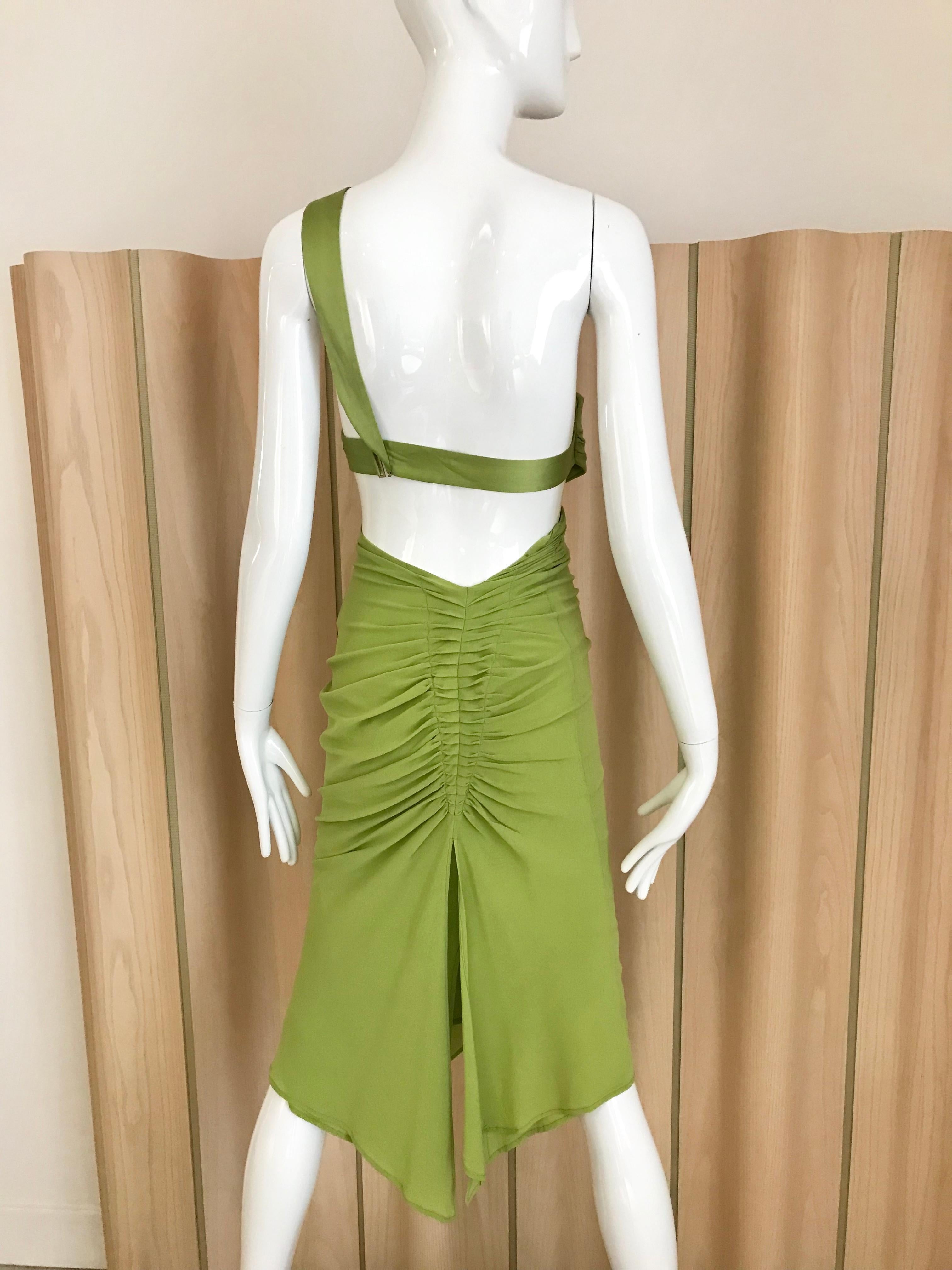 Green Gucci by Tom Ford cut out silk dress. 
Marked size 40 but it fit small than 40. Best to fit size 0 or 2 US size
See exact measurement below:
Bust: 30 inches/ waist: 24 inches/ Hip 32 inches/ Dress length 45 inches/
