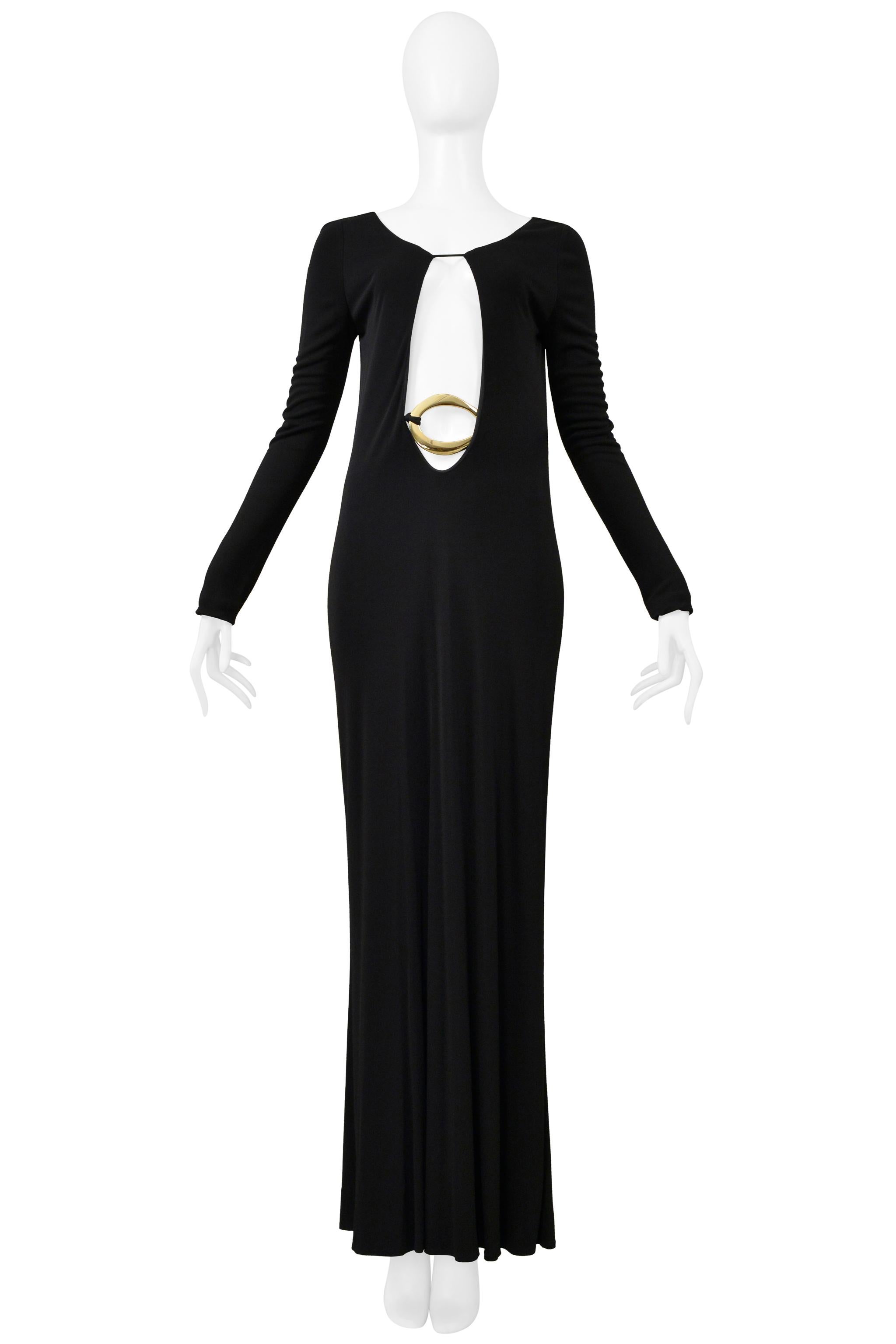 Resurrection Vintage is excited to offer an iconic 1996 Tom Ford for Gucci black jersey evening gown featuring a plunging neckline, long sleeves, jersey fabric with attached interior lining, gold metal sculptural hardware with attached jersey belt