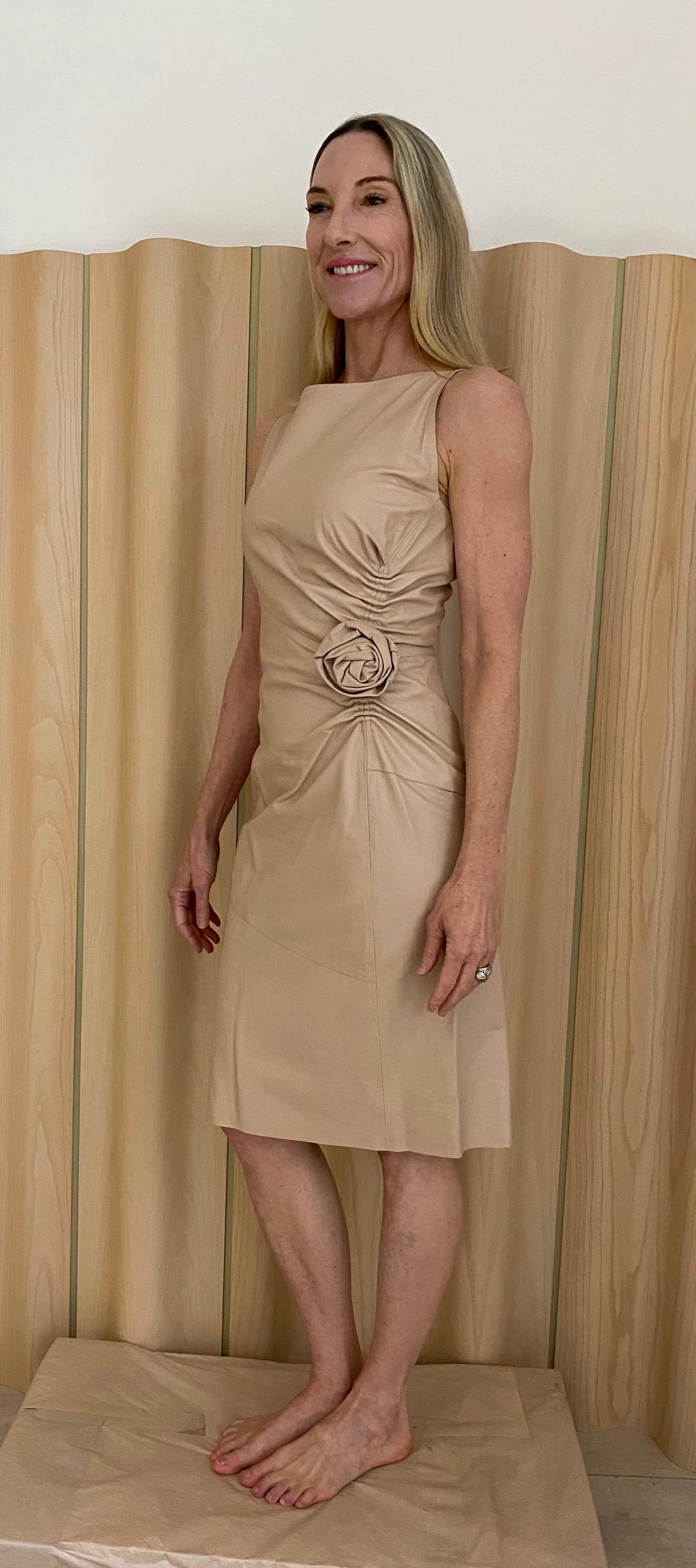 Gucci by Tom Ford light blush color soft leather dress with rosette.  Very flattering and chic.
Fit size US 4