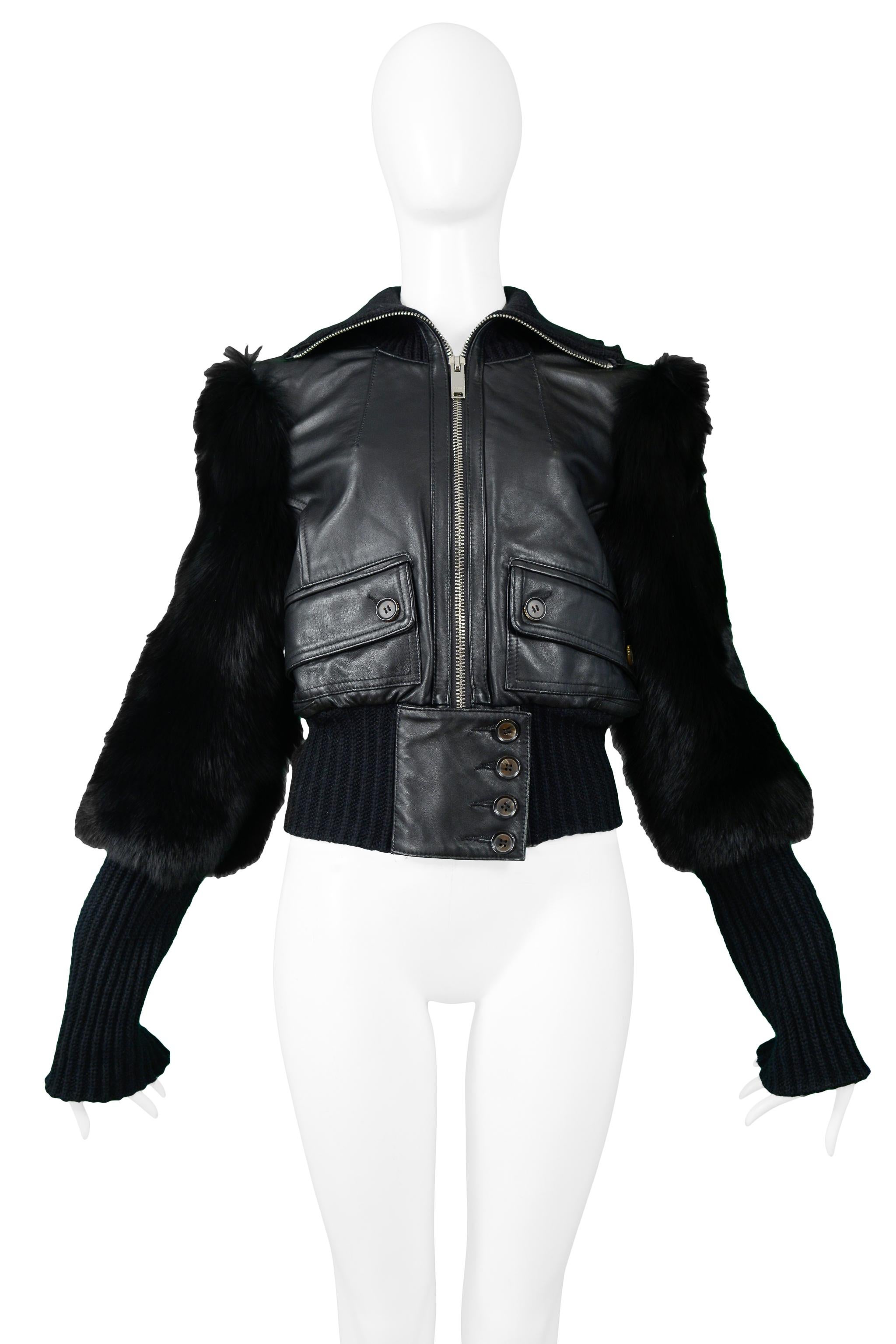 Resurrection Vintage is pleased to offer a vintage black leather and fox fur Tom Ford for Gucci mini-bomber jacket featuring a zipper and button closure, knit waistband and cuffs, fur sleeves, button-flap pockets, and high neck. 

Gucci
Designed by