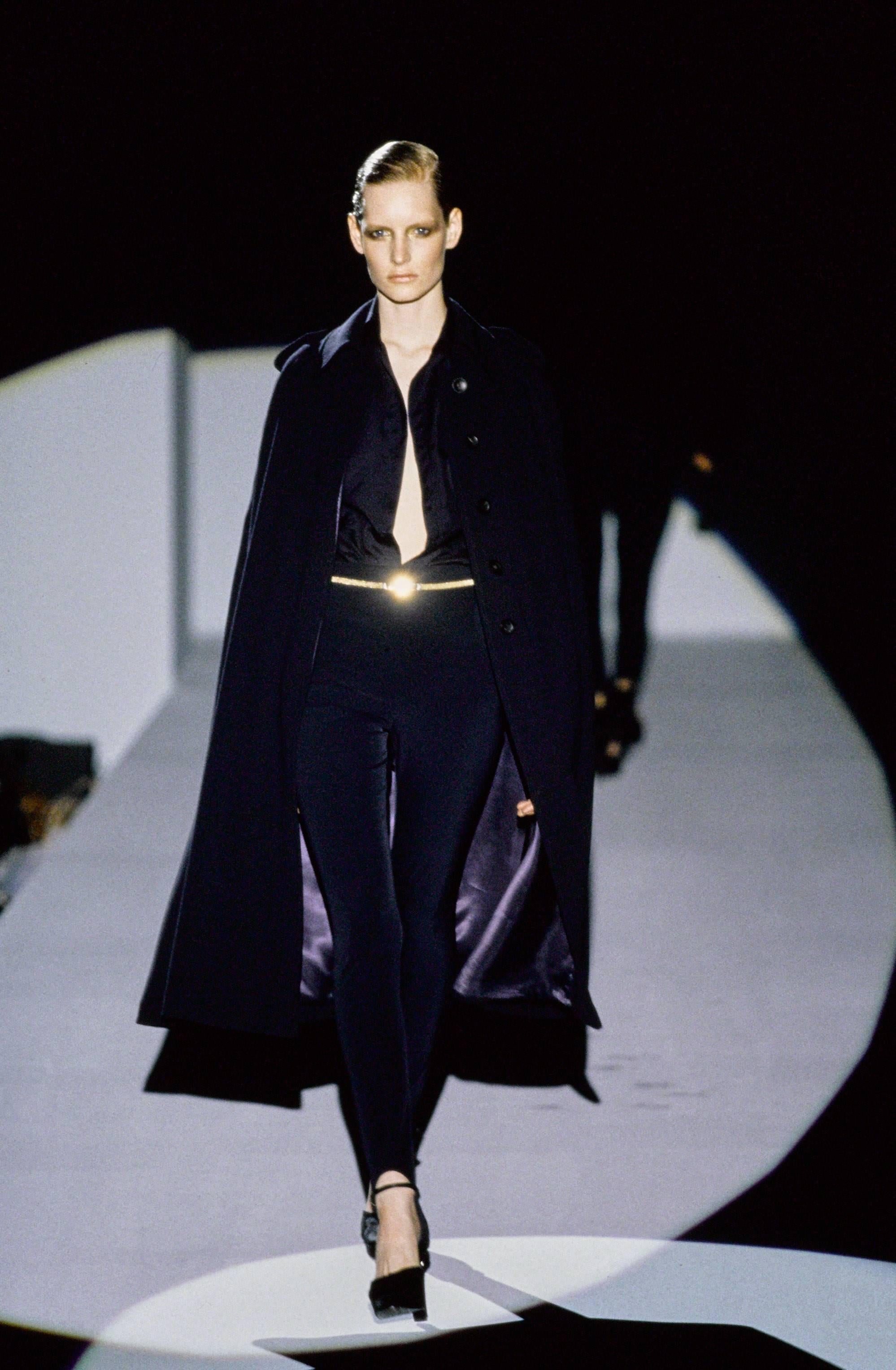 - Gucci by Tom Ford navy wool long cape coat  from fall 1996 collection.  Model Kristian Owen was rocking it on the runway!

- Featuring five buttons in front closure, epaulette shoulder design. 

-- This piece is one of a kind and has never been