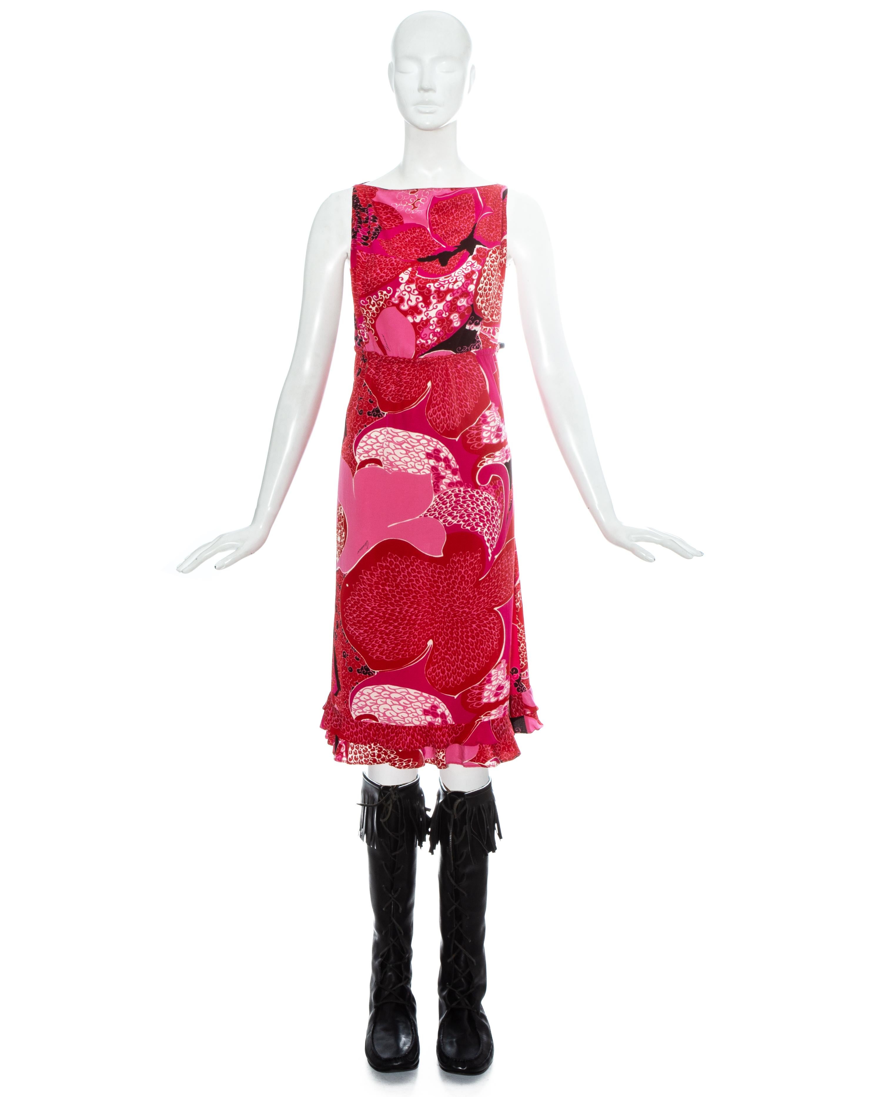 Gucci by Tom Ford pink and red floral printed silk sleeveless dress with ruffled hem and leather waistband. Sold with black leather knee high boots with fringed trim and lace up fastening. The complete ensemble worn on the runway (look