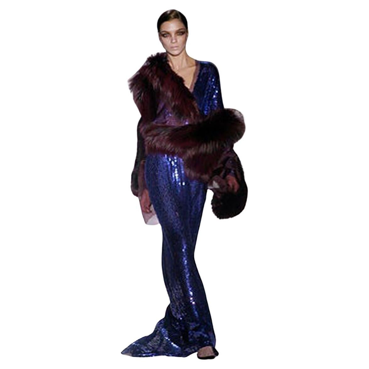 As seen on the f/w Gucci 2004 runway collection.  Highly coveted an impressive and inspiring gown definitely designed for special occasion dressing.

Long dress with plunging neckline, long sleeves and side cutout accent.  Narrow key hole back with